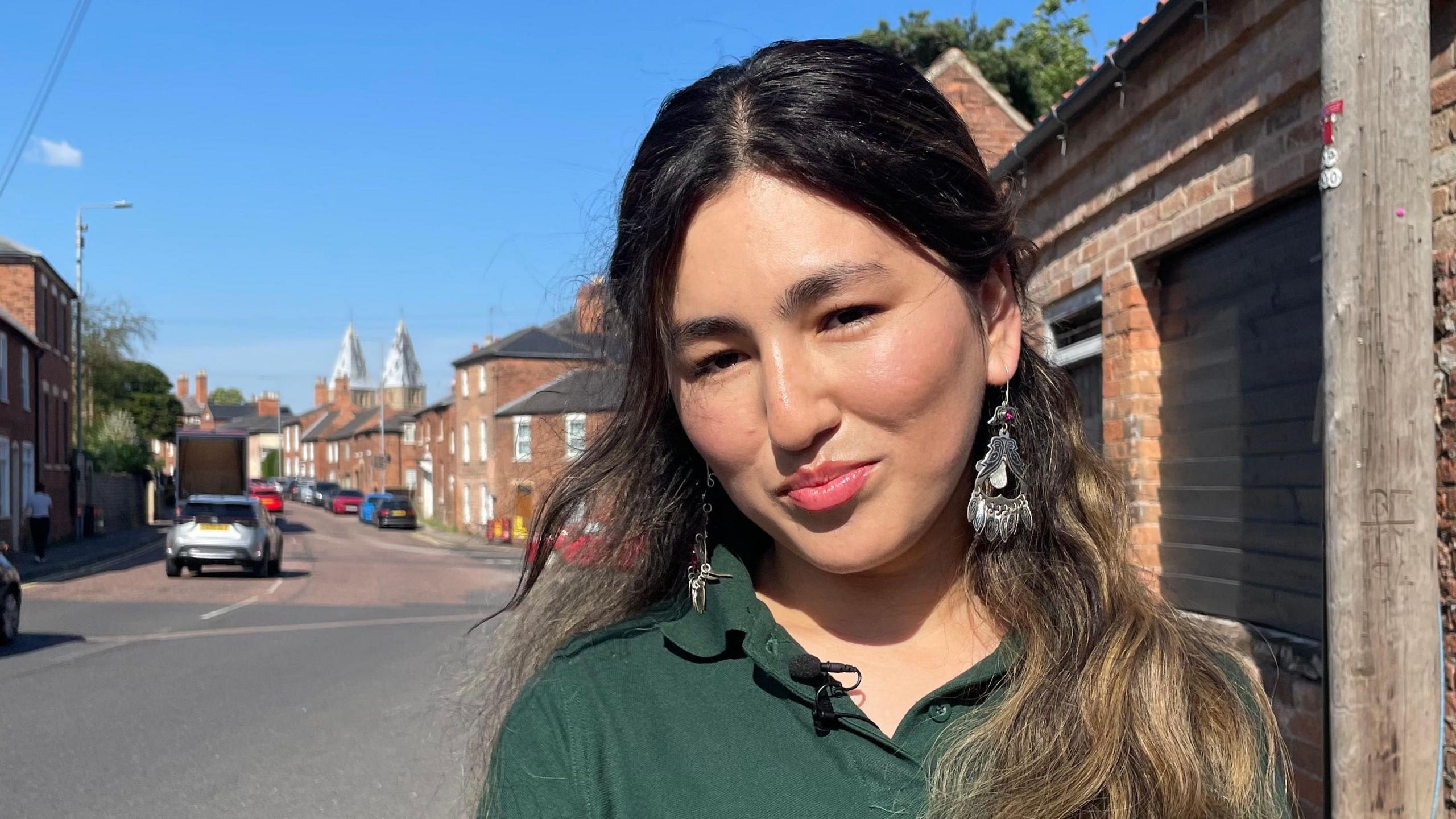 Pervin in front of the traditional houses and minster in Southwell