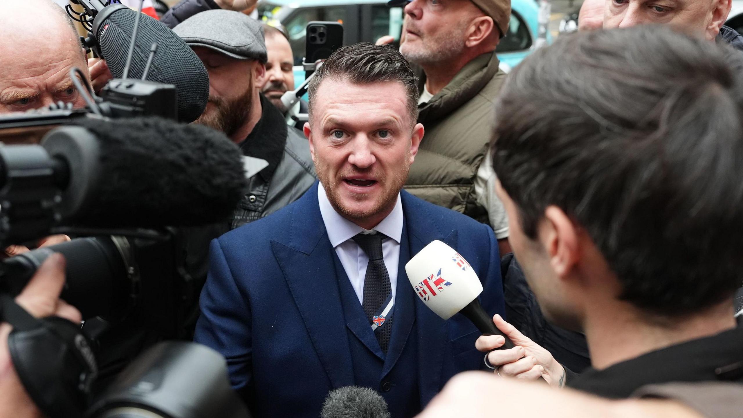 Tommy Robinson, whose real name is Stephen Yaxley-Lennon, speaks to the press at Westminster Magistrates' Court