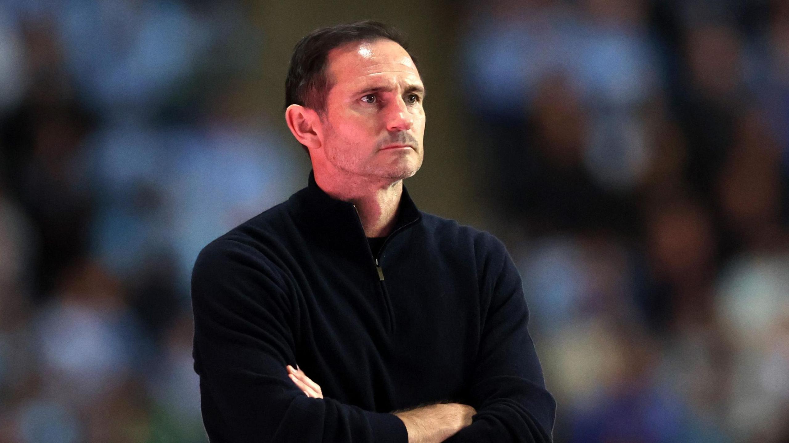 Frank Lampard watching Coventry with his arms folded