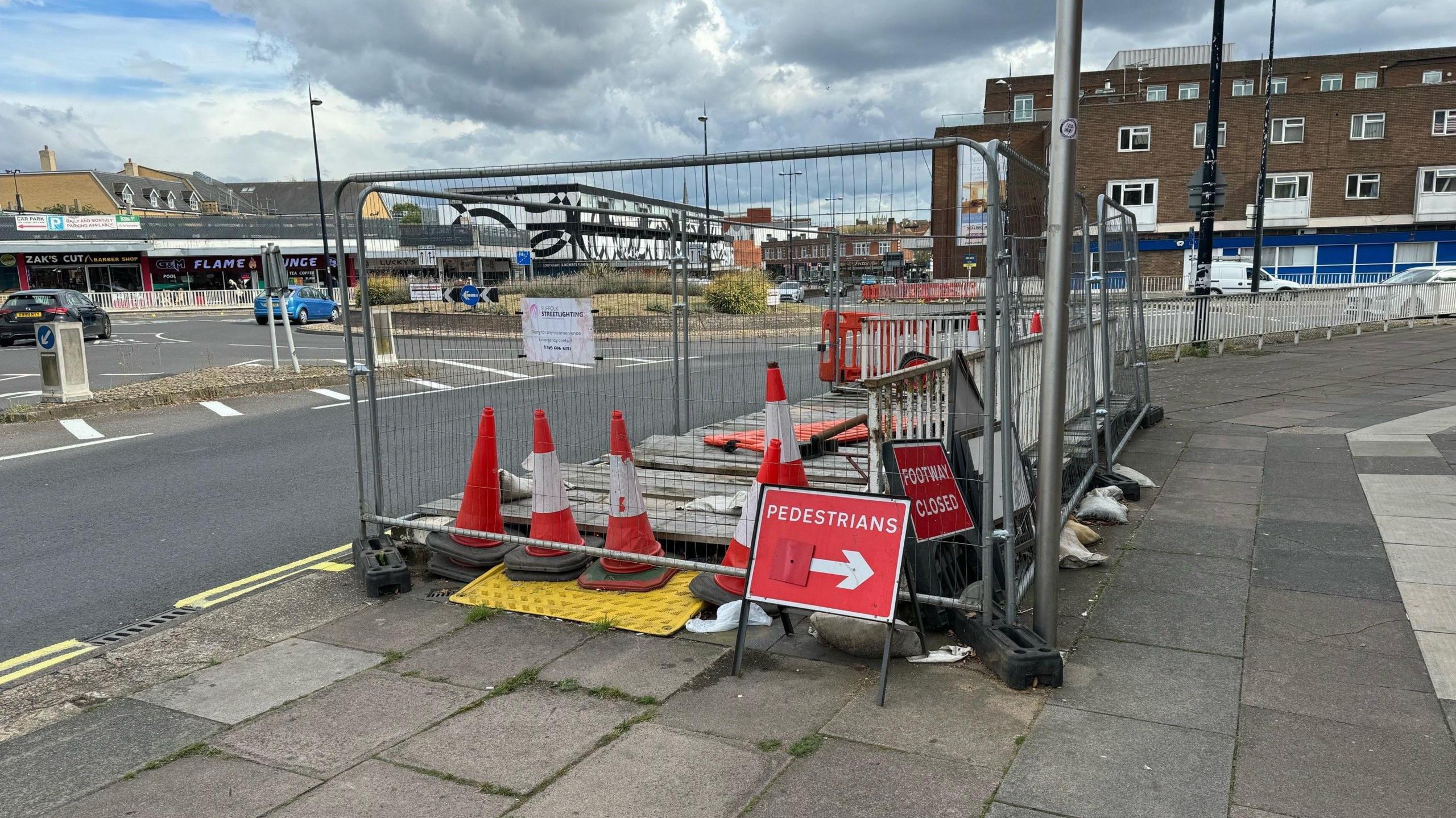 Cones and metal barriers block the entrance to the underpass in Ipswich