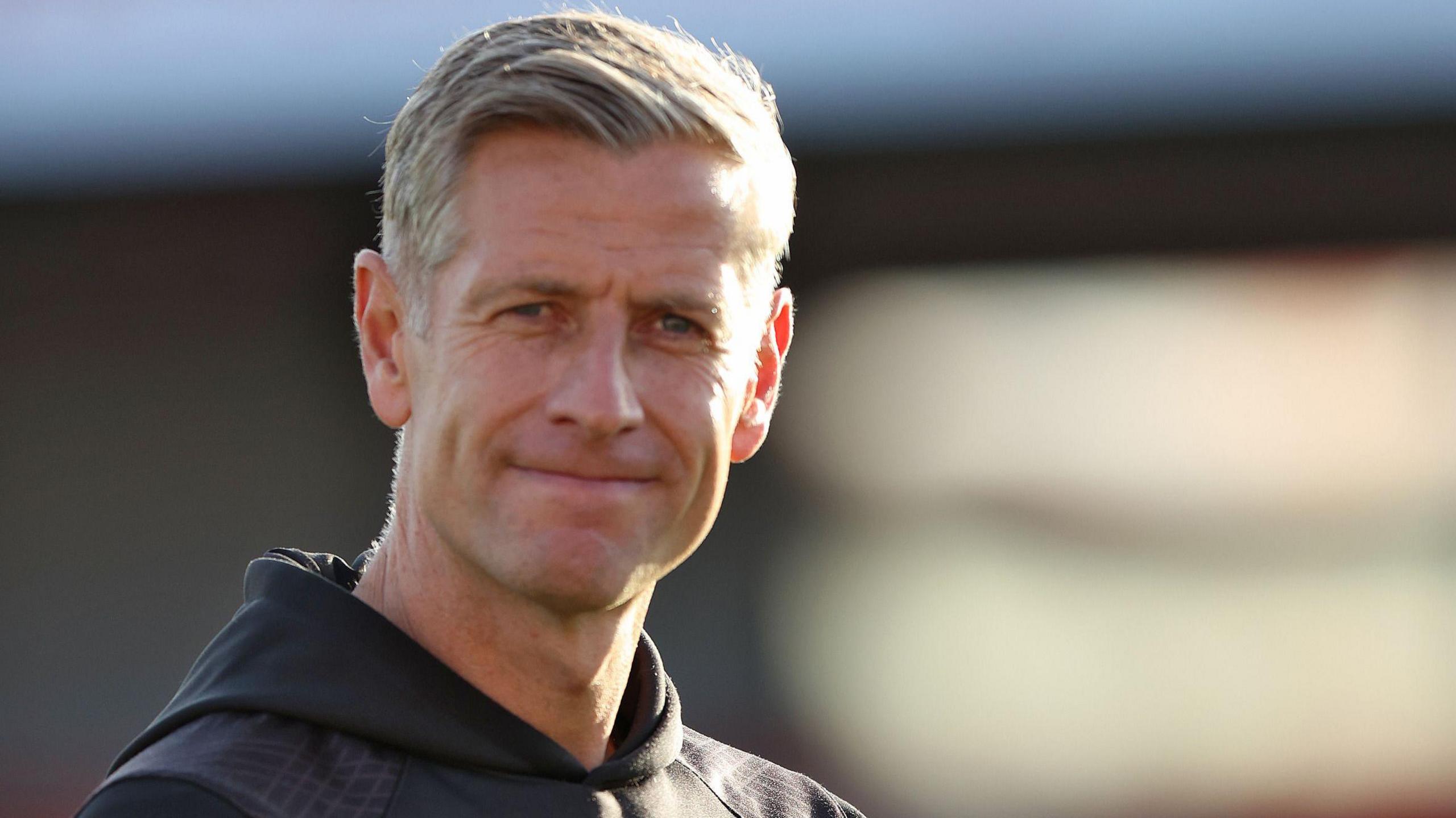 Newport County manager David Hughes applauds his team’s win at Accrington Stanley