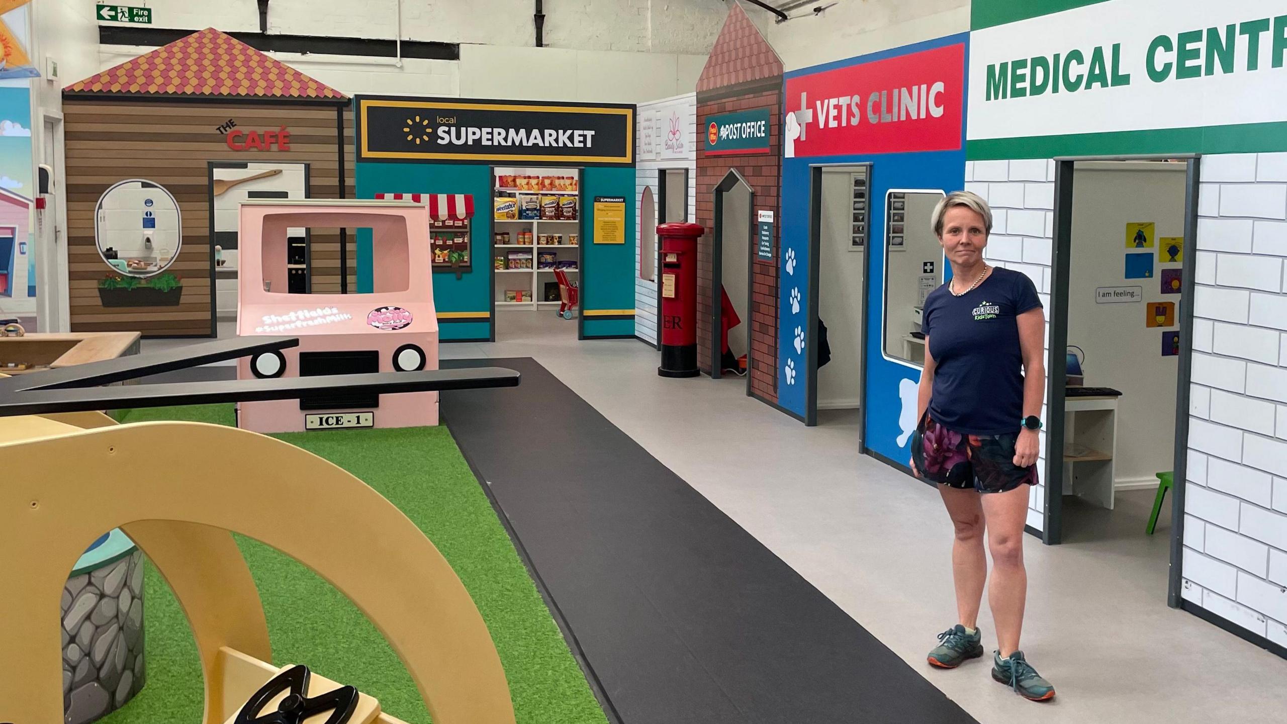 Rachael Parker stood inside the empty play area, which is modelled after a high street, complete with the supermarket, vet's clinic, medical centre, and café.
