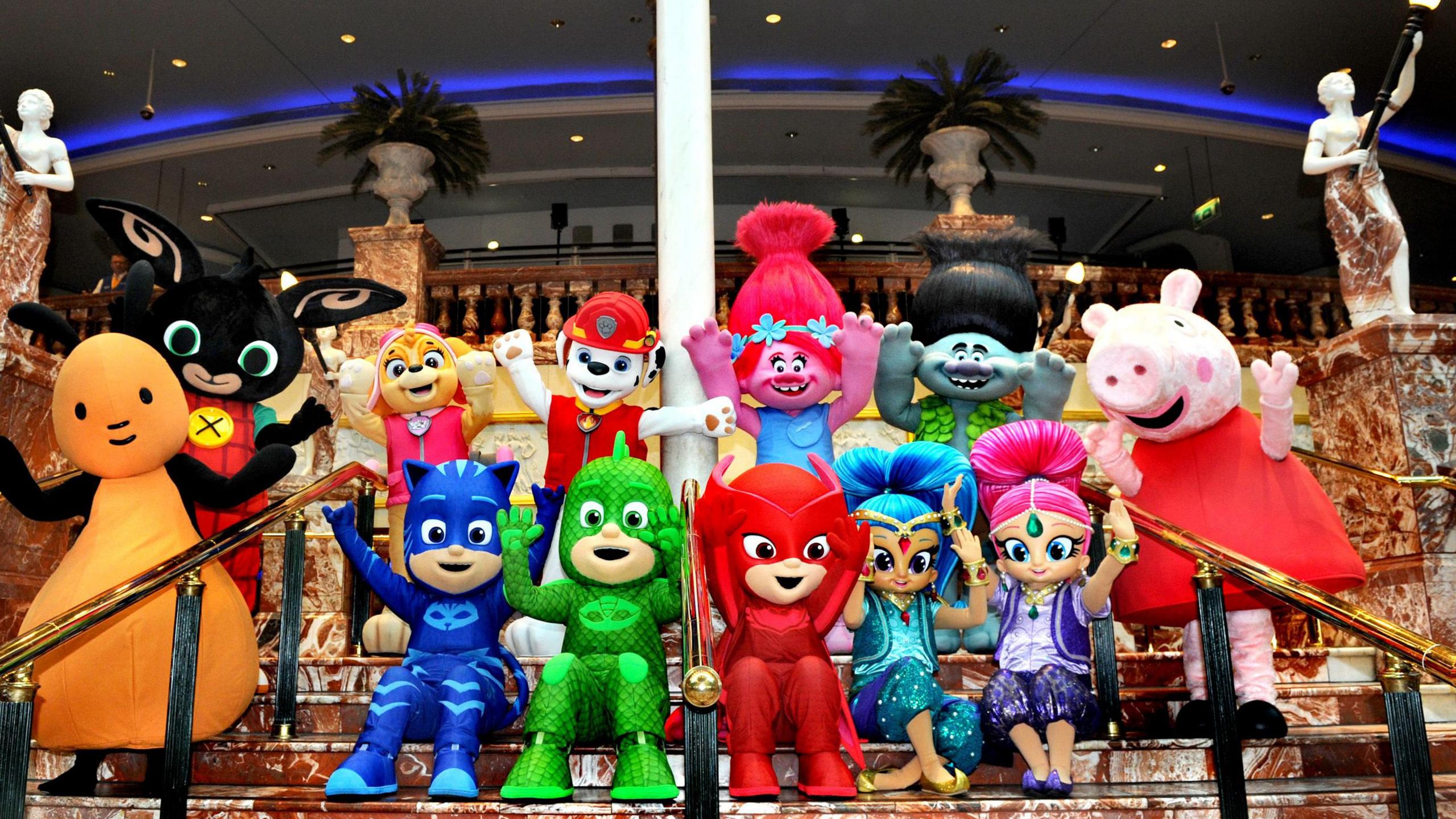 A host of characters from children's TV programmes including Shimmer & Shine, the Trolls, Paw Patrol, PJ masks, Bing and Peppa Pig on the steps of the Orient in the Trafford Centre shopping complex for the Christmas Parade.