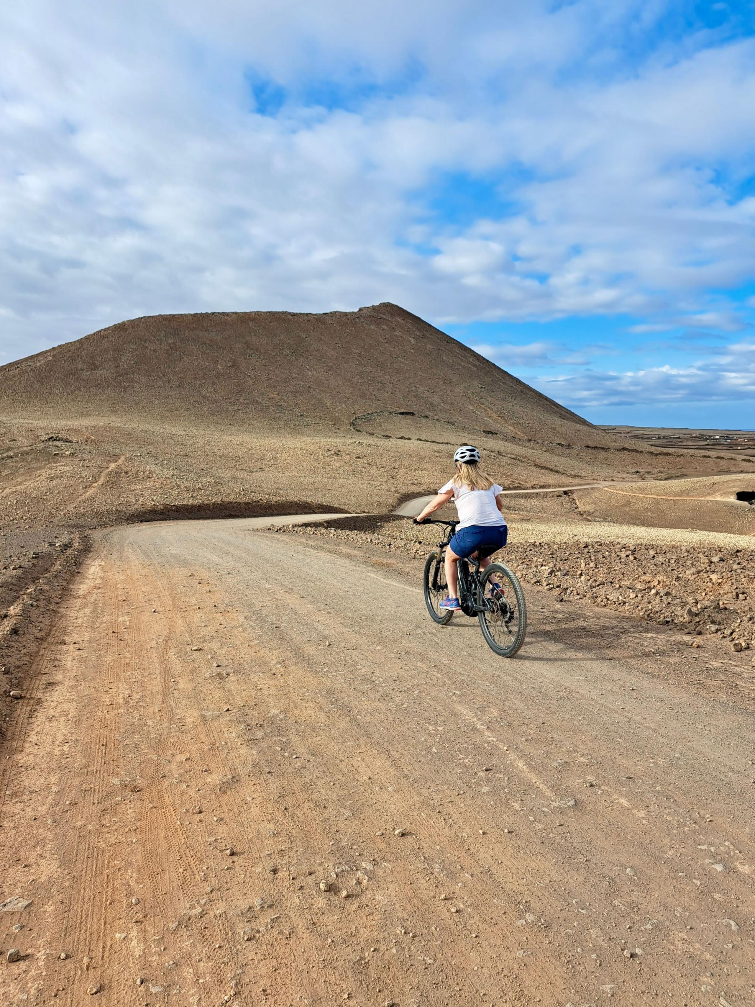 A woman on a bicycle in Fuerteventura 