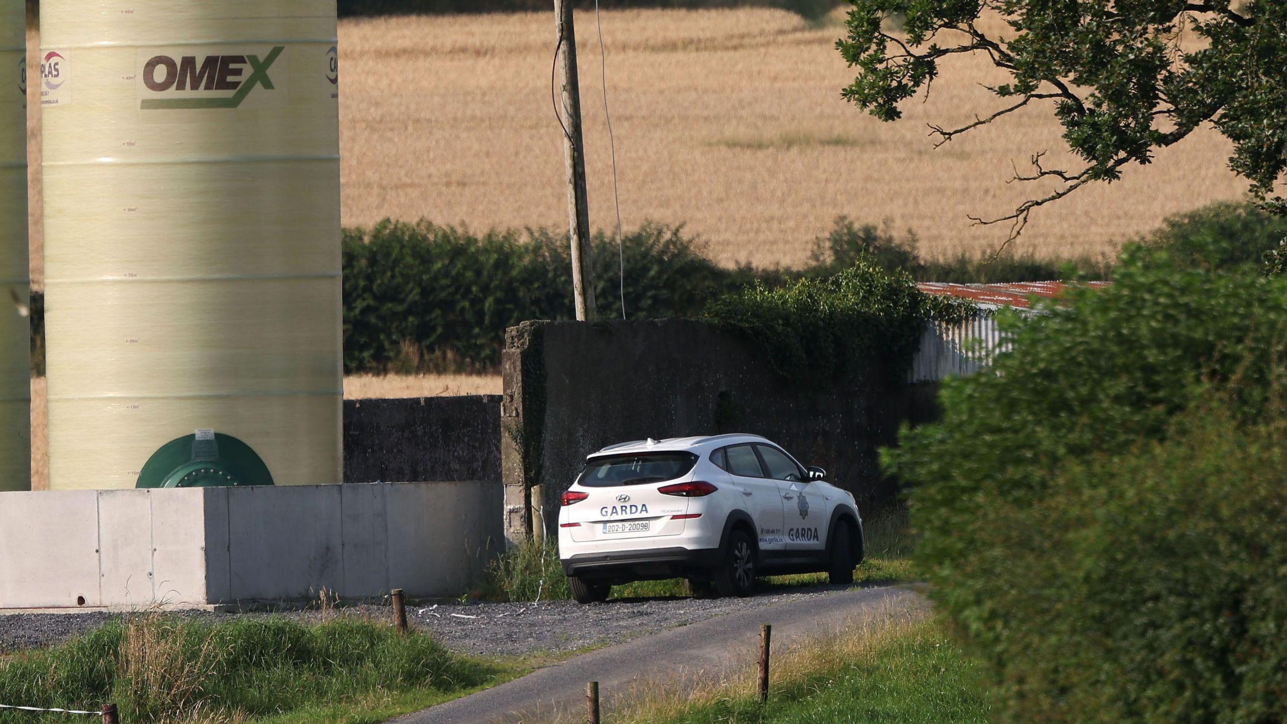 Garda car in the vicinity of a farm