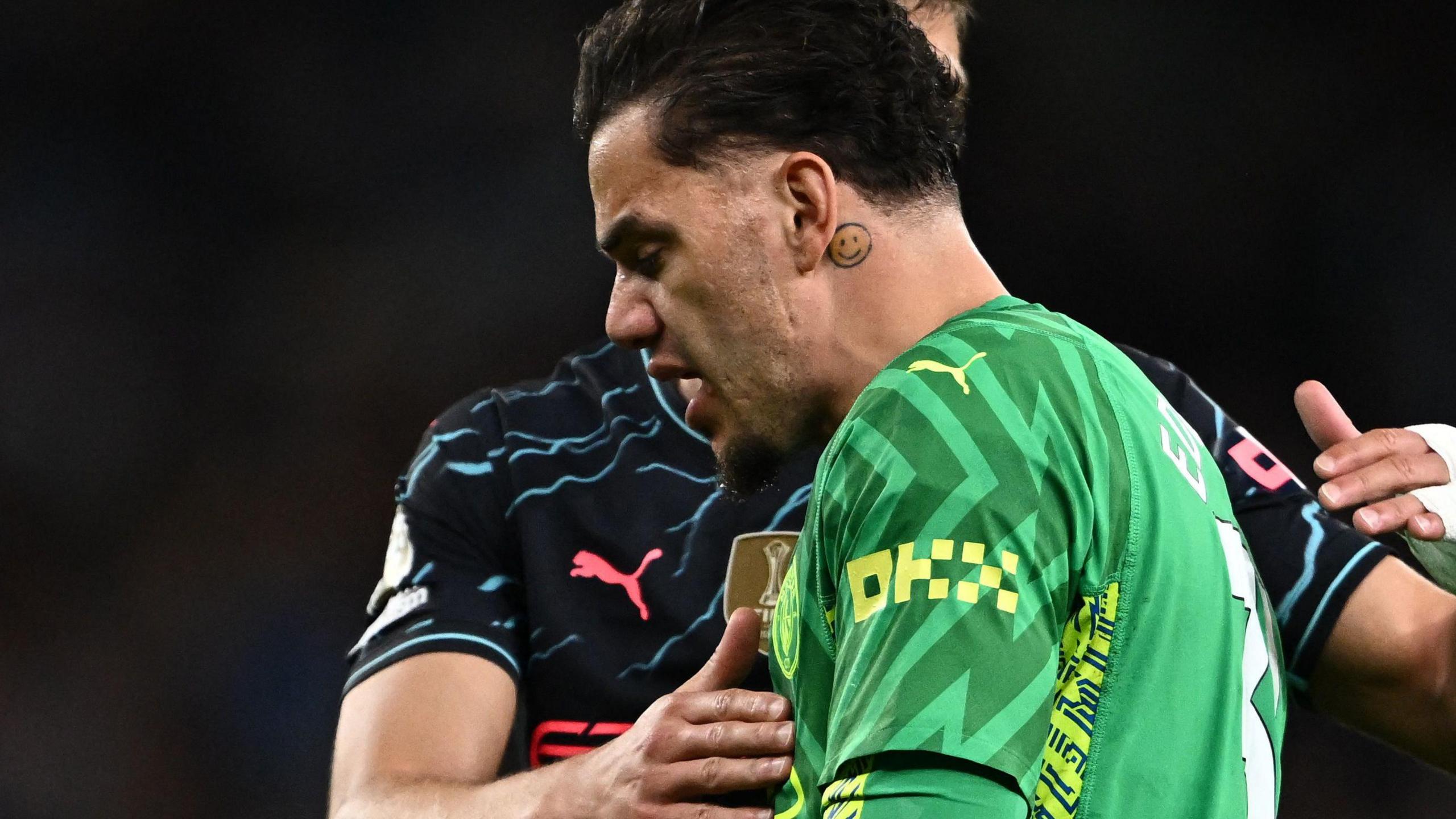 Manchester City goalkeeper Ederson walks off the pitch at Tottenham