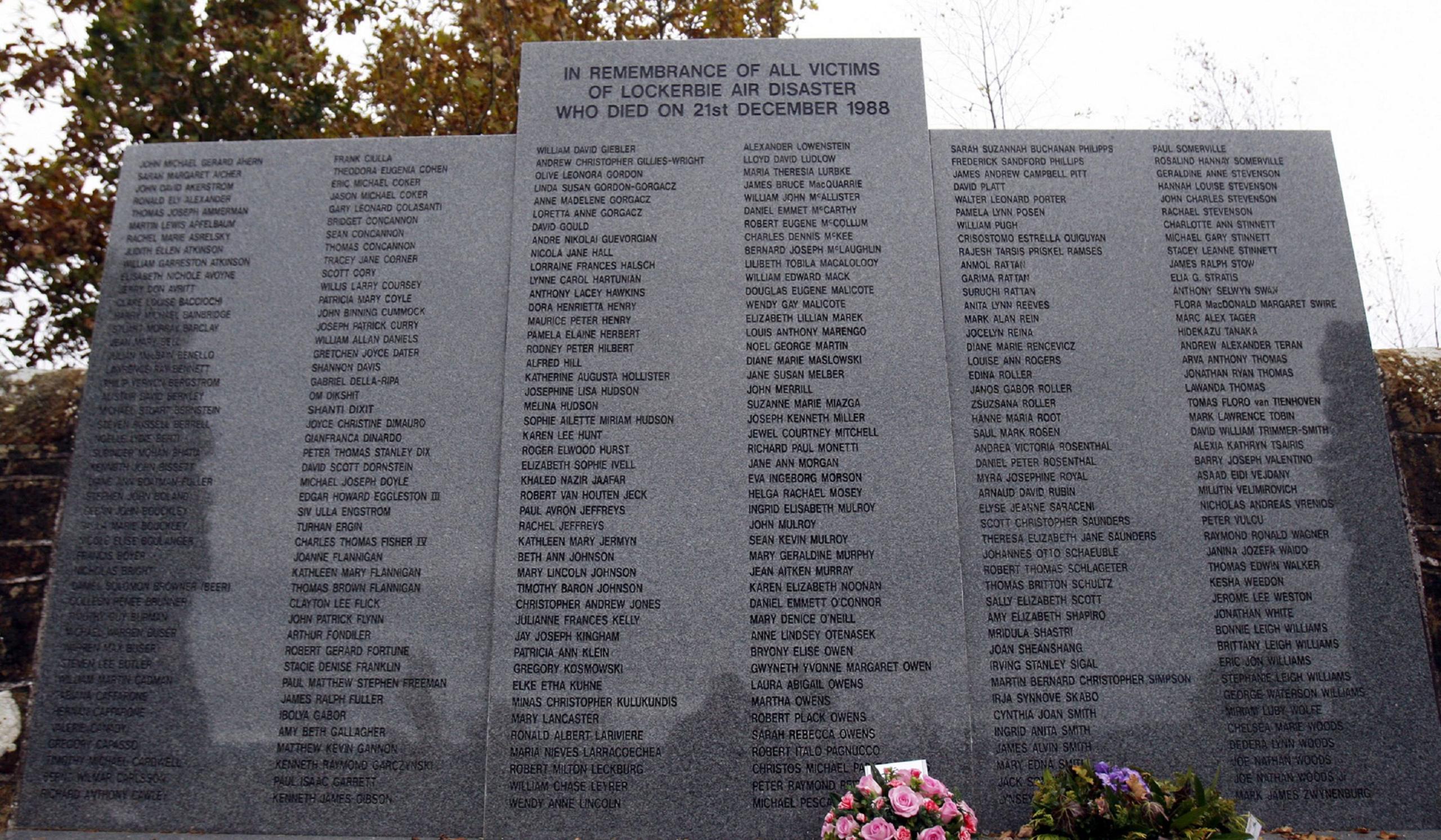 Grey memorial stone listing the names of everyone who died in the Lockerbie bombing