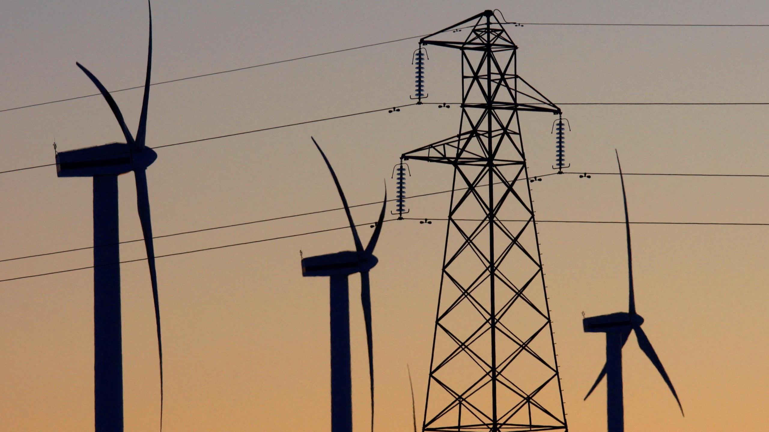 wind turbines and an electricity pylon.