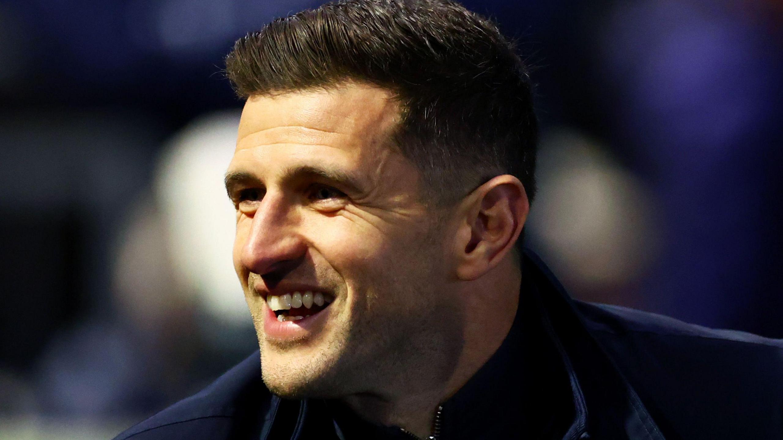 A smiling Portsmouth boss John Mousinho