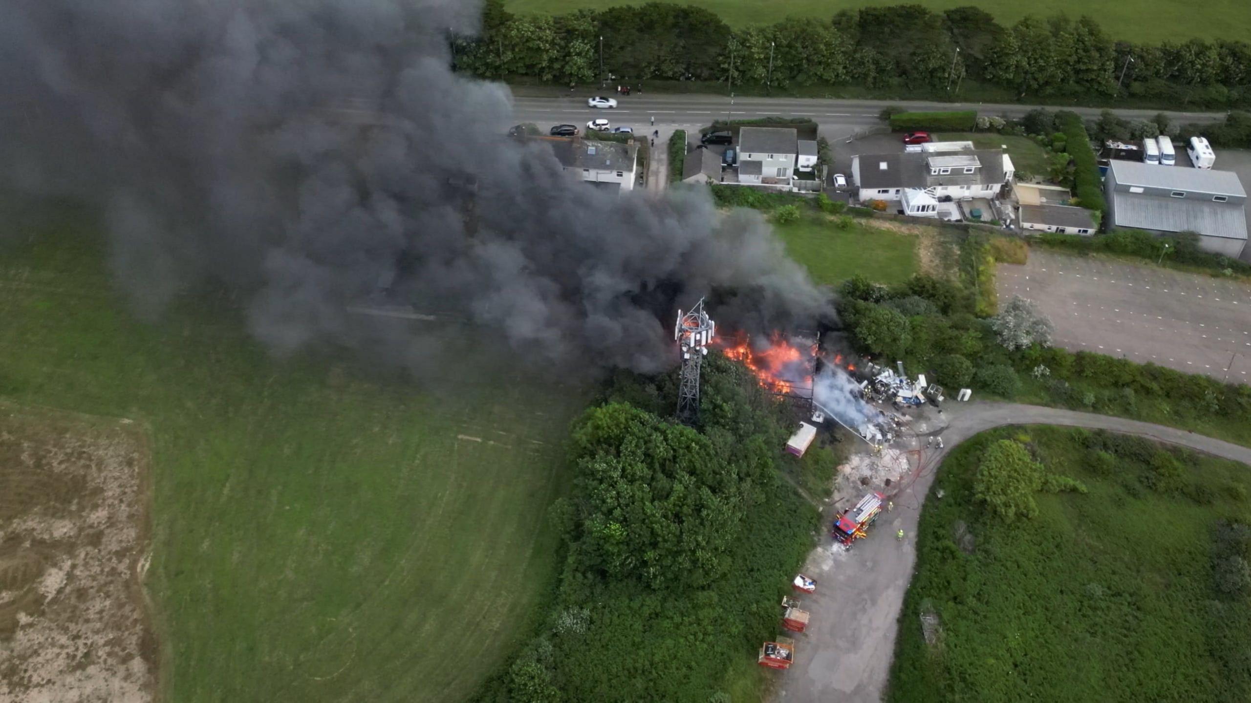 Picture shows thick smoke pouring from the fire