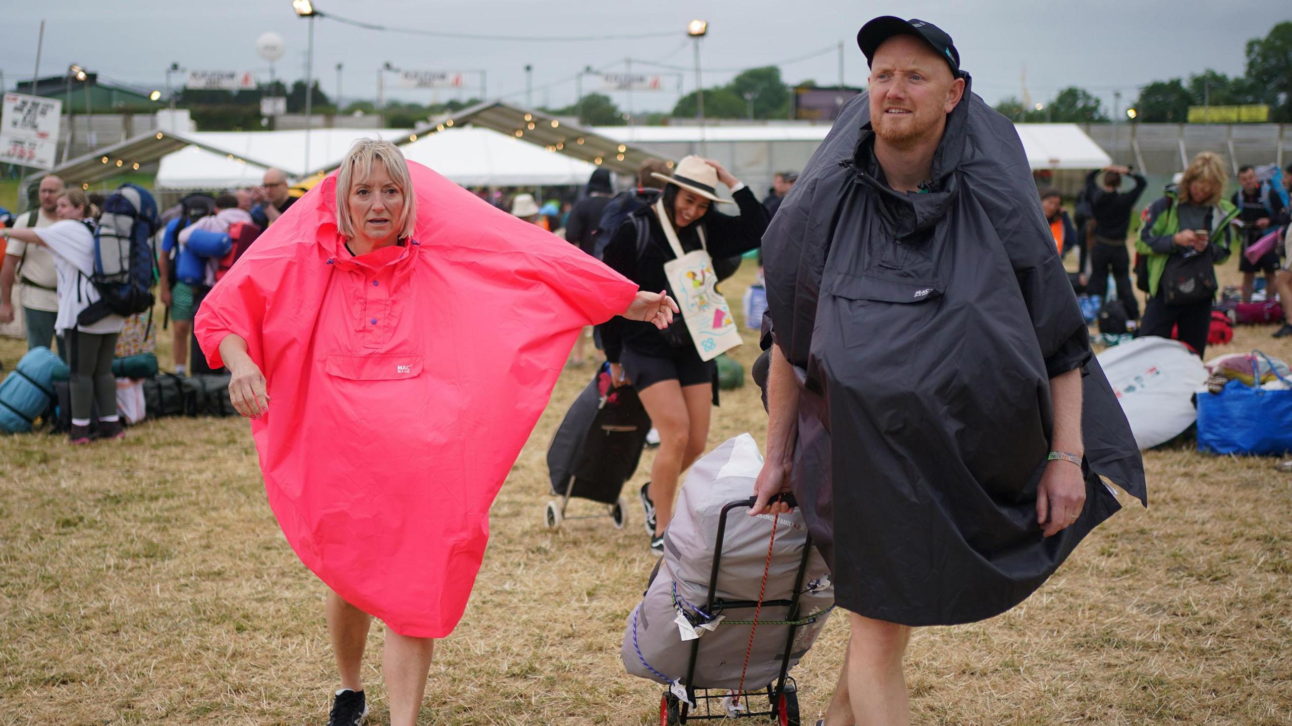 A man and a woman in rain gear