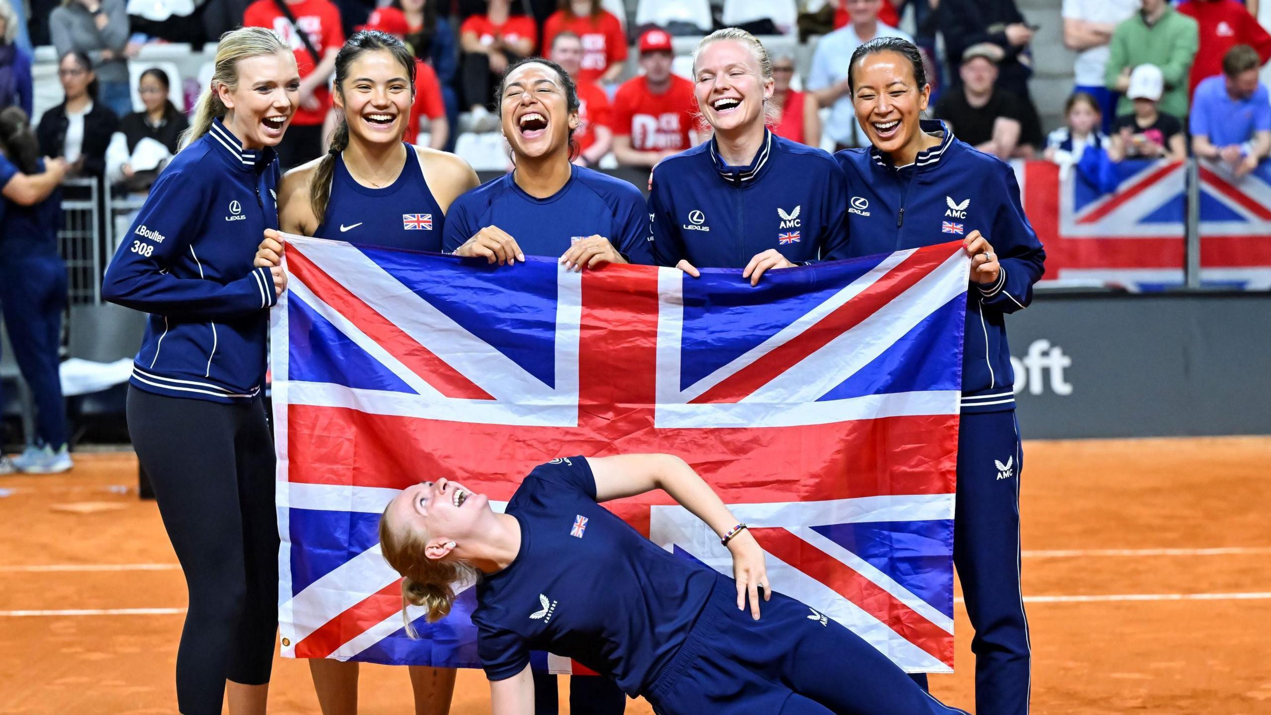 Fran Jones celebrates with her Great Britain team-mates after their BJK Cup win against France