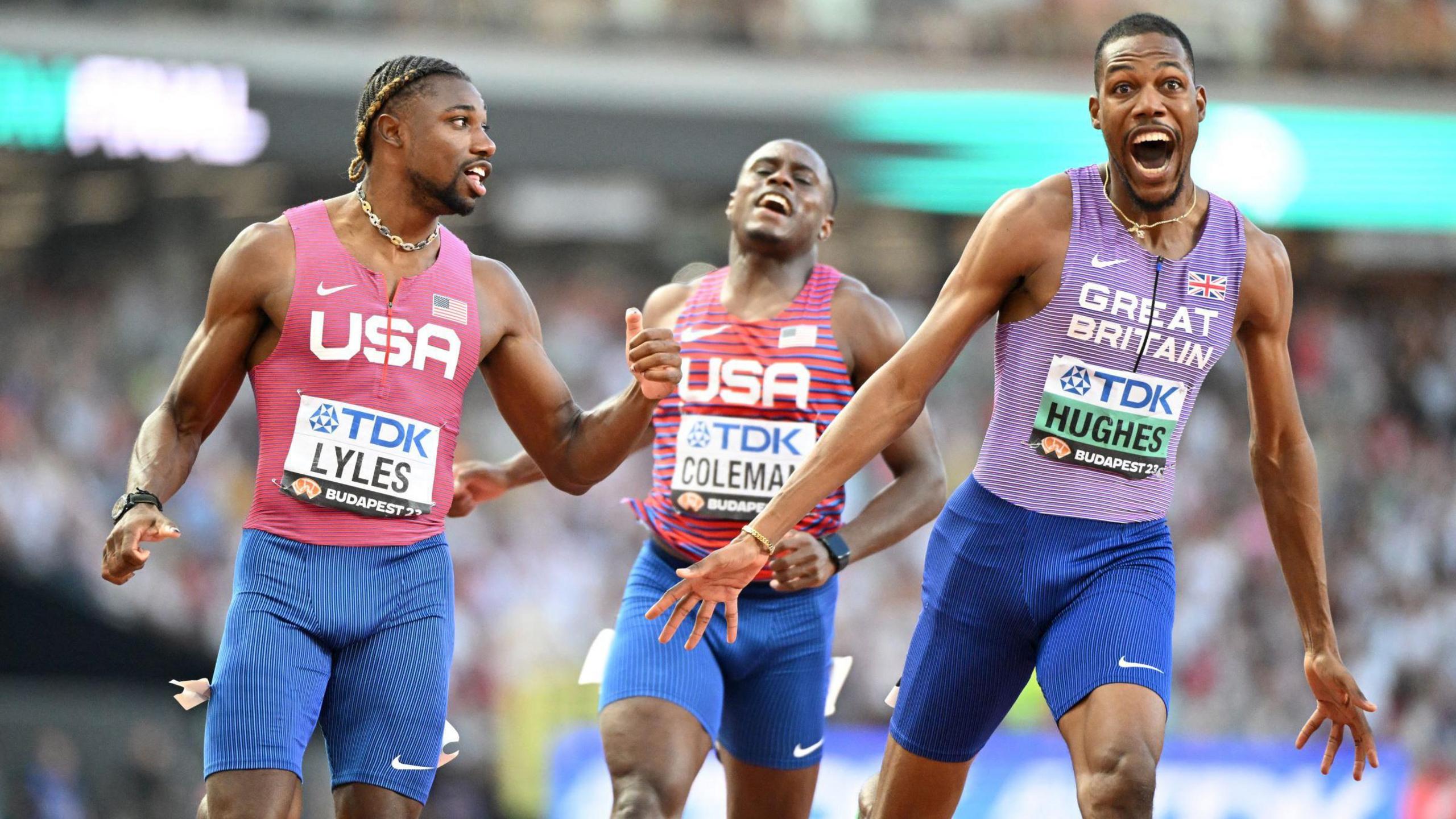 Zharnel Hughes celebrates after winning world bronze