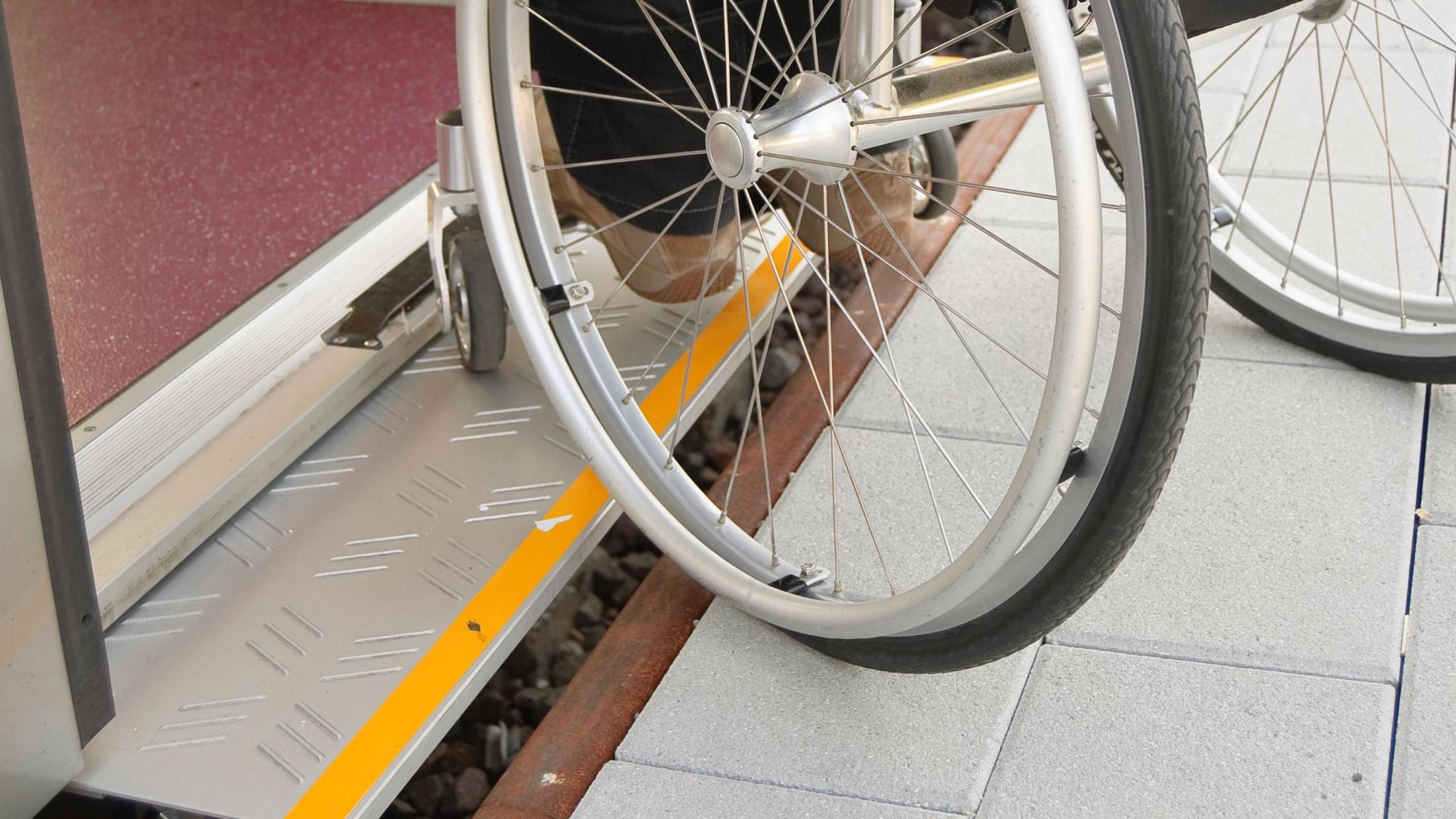 Wheelchair struggles to board train 