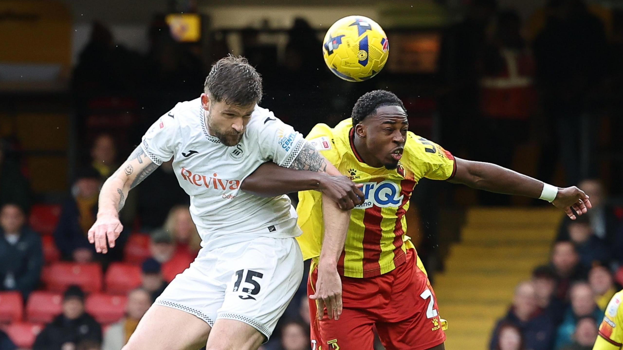 Cameron Burgess competes with Jeremy Ngakia 