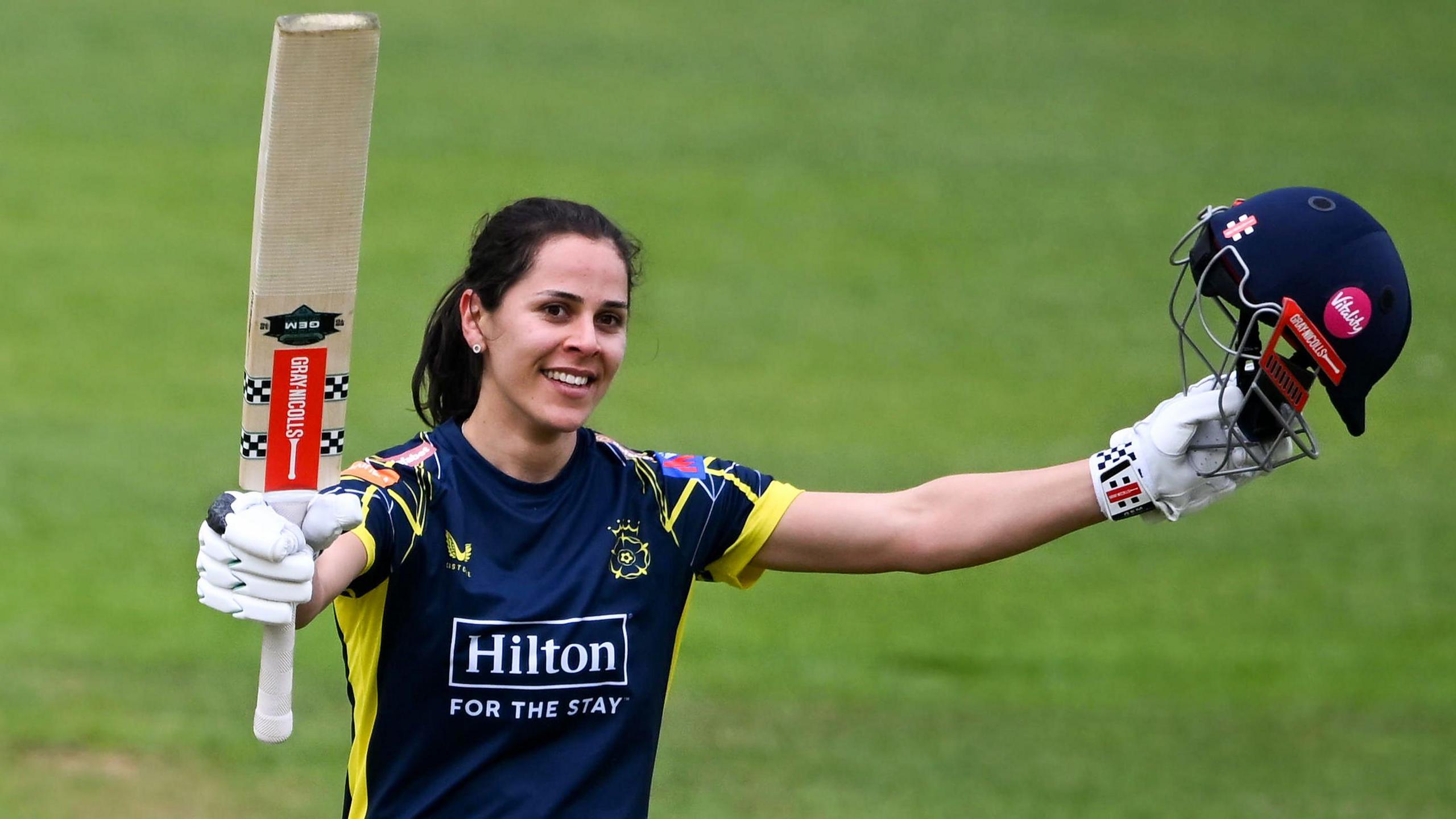 Hampshire's Maia Bouchier celebrates reaching her century against Somerset