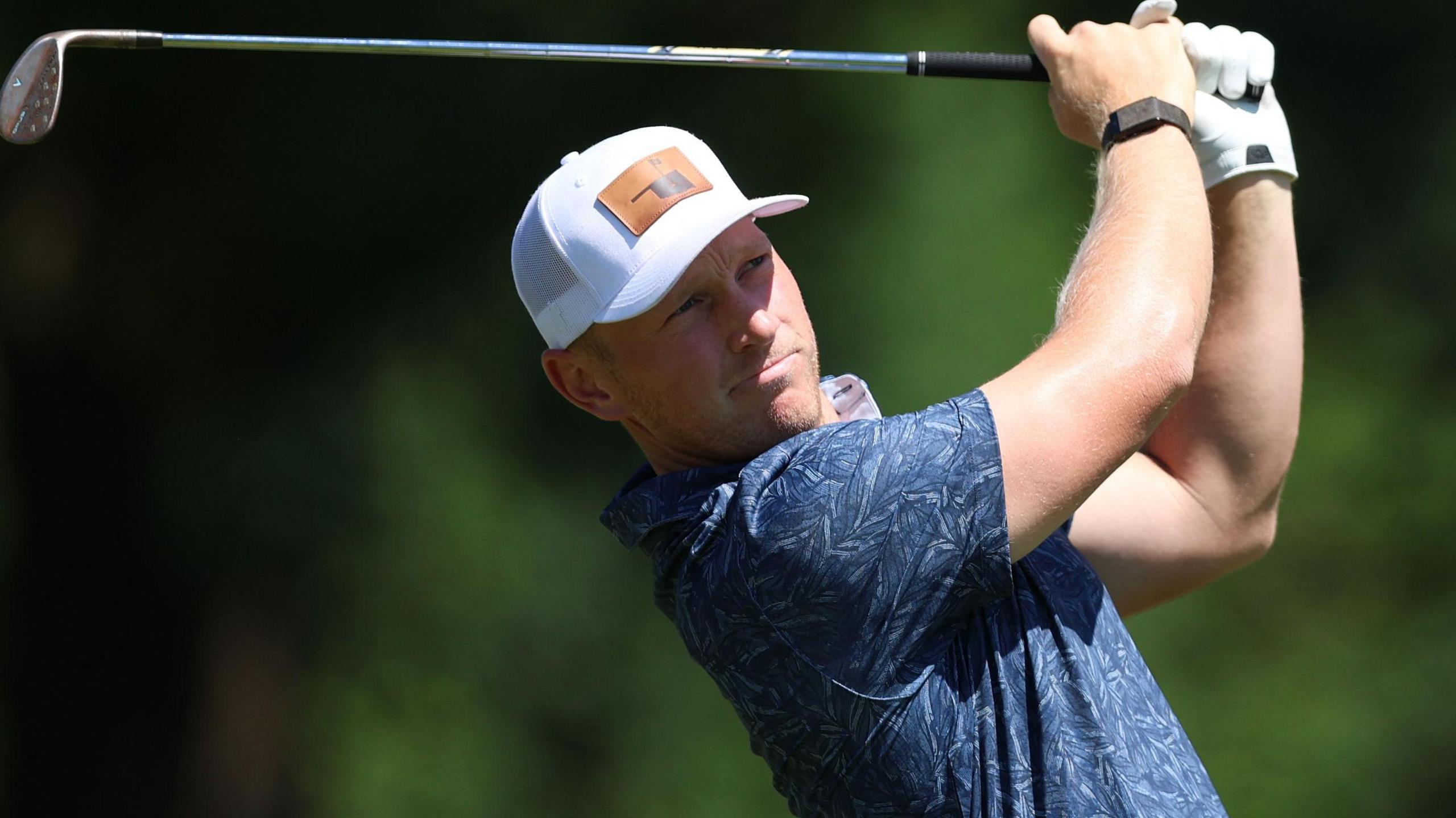 Brad Dalke plays a shot