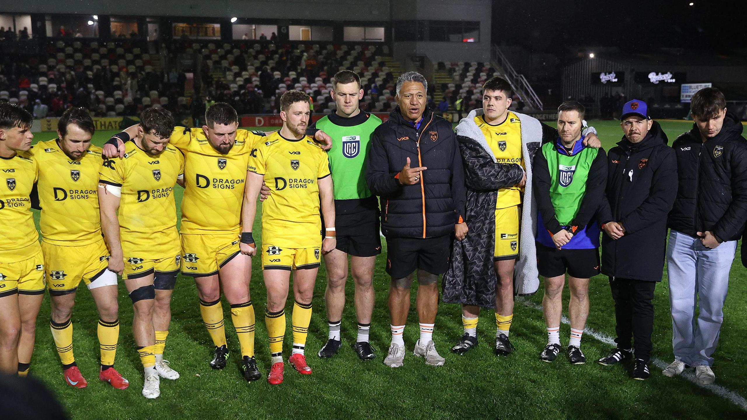 Dragons head coach Filo Tiatia addresses the players after the defeat to Leinster at Rodney Parade
