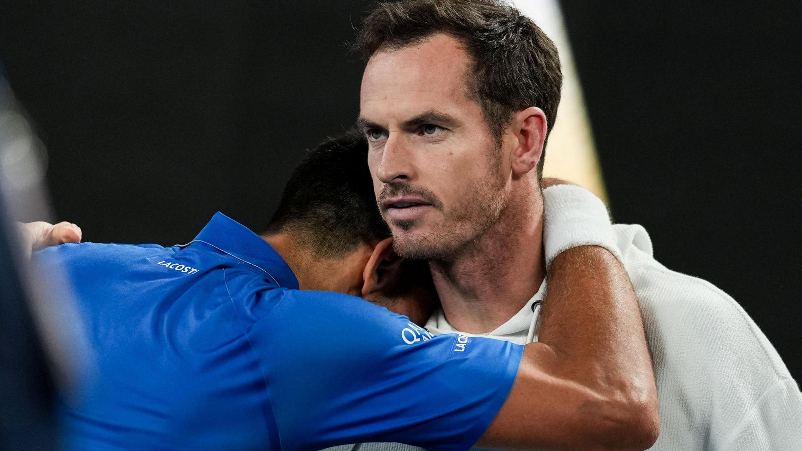 Novak Djokovic hugs Andy Murray after the Serb beat Carlos Alcaraz