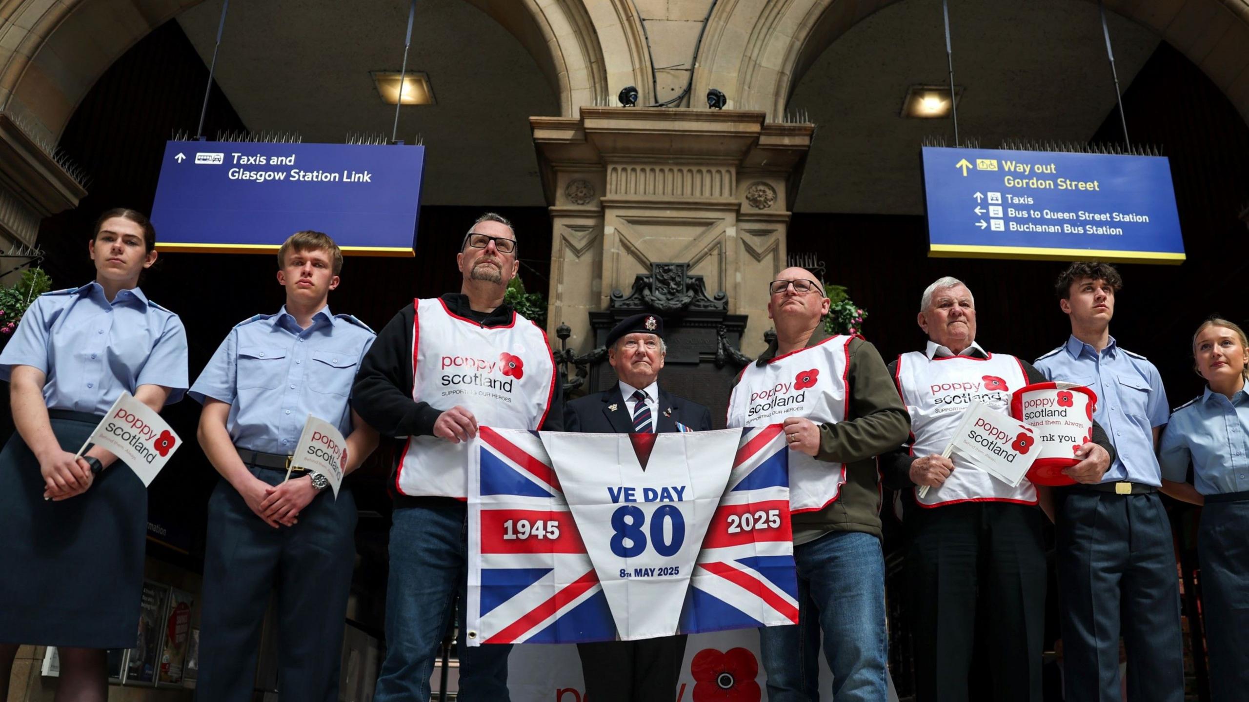 Members of poppy Scotland observe two minutes of silence in Glasgow