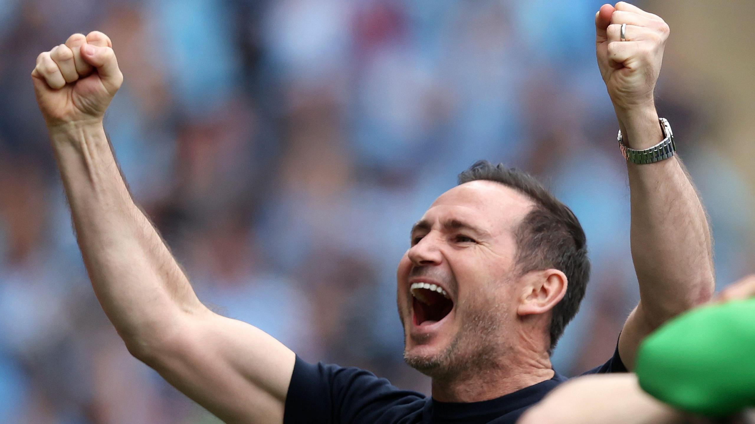 Frank Lampard with fists clenched and both arms in the air