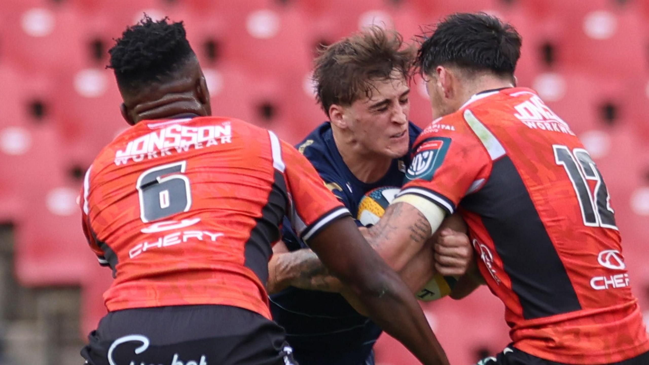 Huw Anderson carries the ball for Dragons at Lions