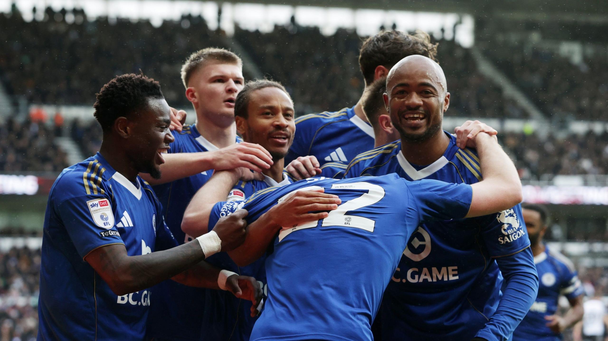 Leicester players celebrate scoring against Derby