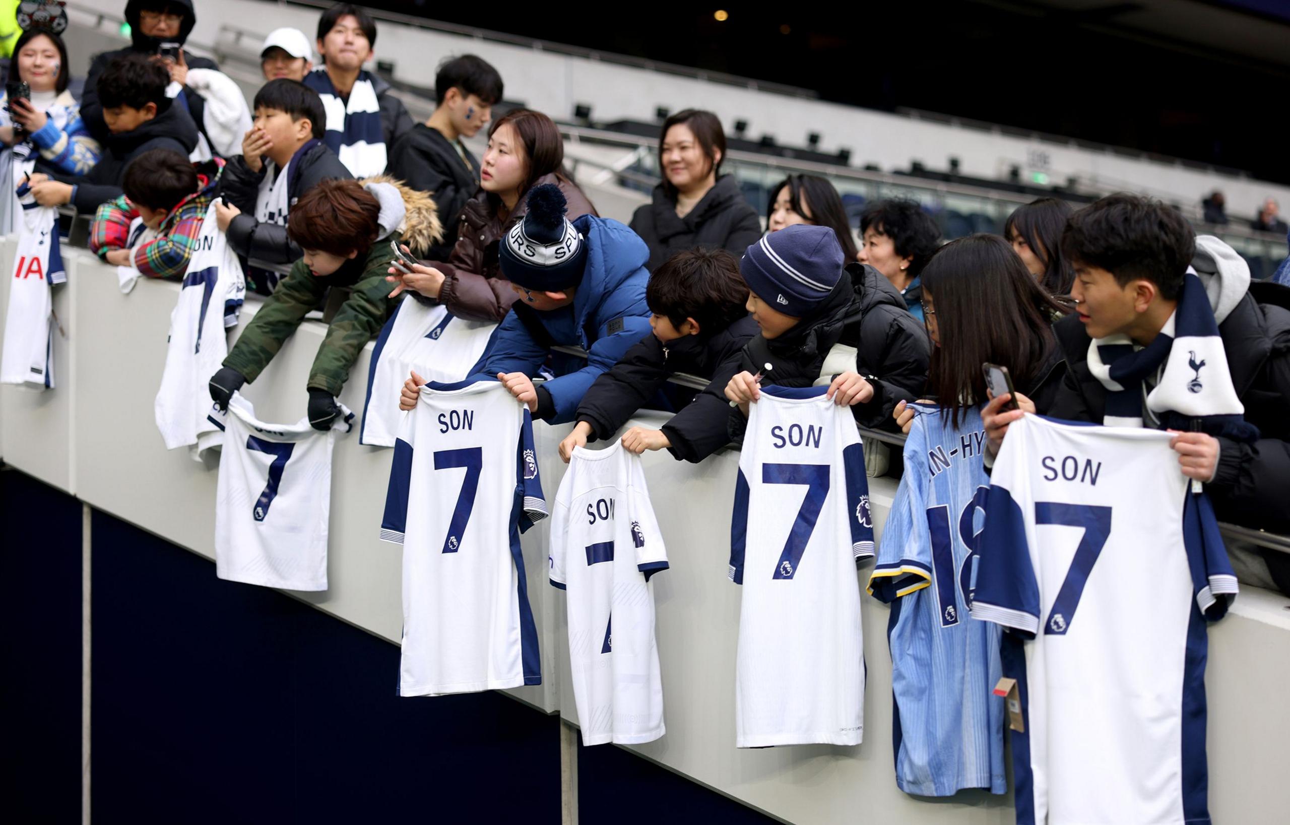 Young fans are seen displaying shirts for Son Heung-Min of Tottenham Hotspur prior to the Premier League match between Tottenham and Leicester at Tottenham Hotspur Stadium 