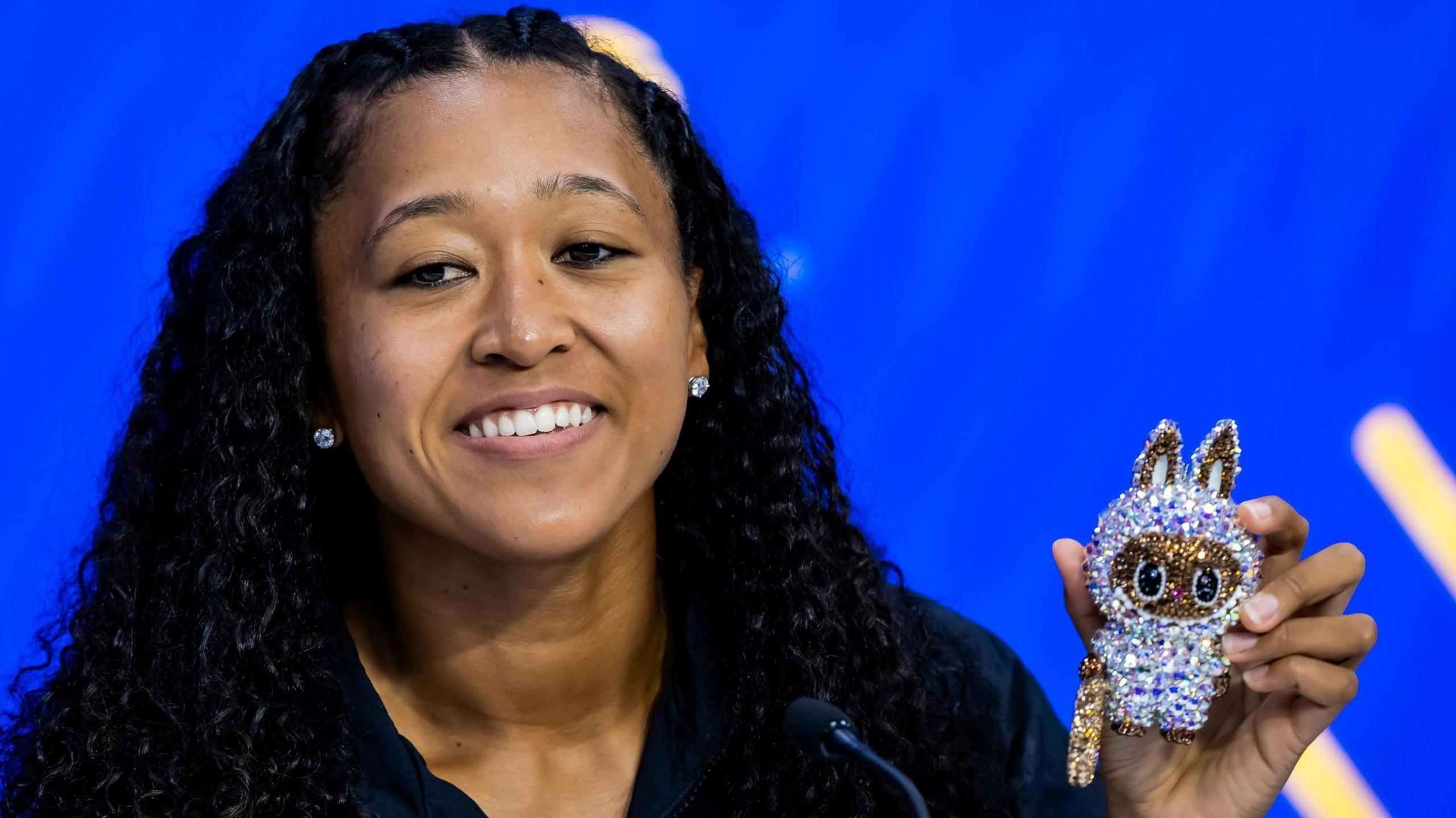 Naomi Osaka shows one of her Labubu dolls