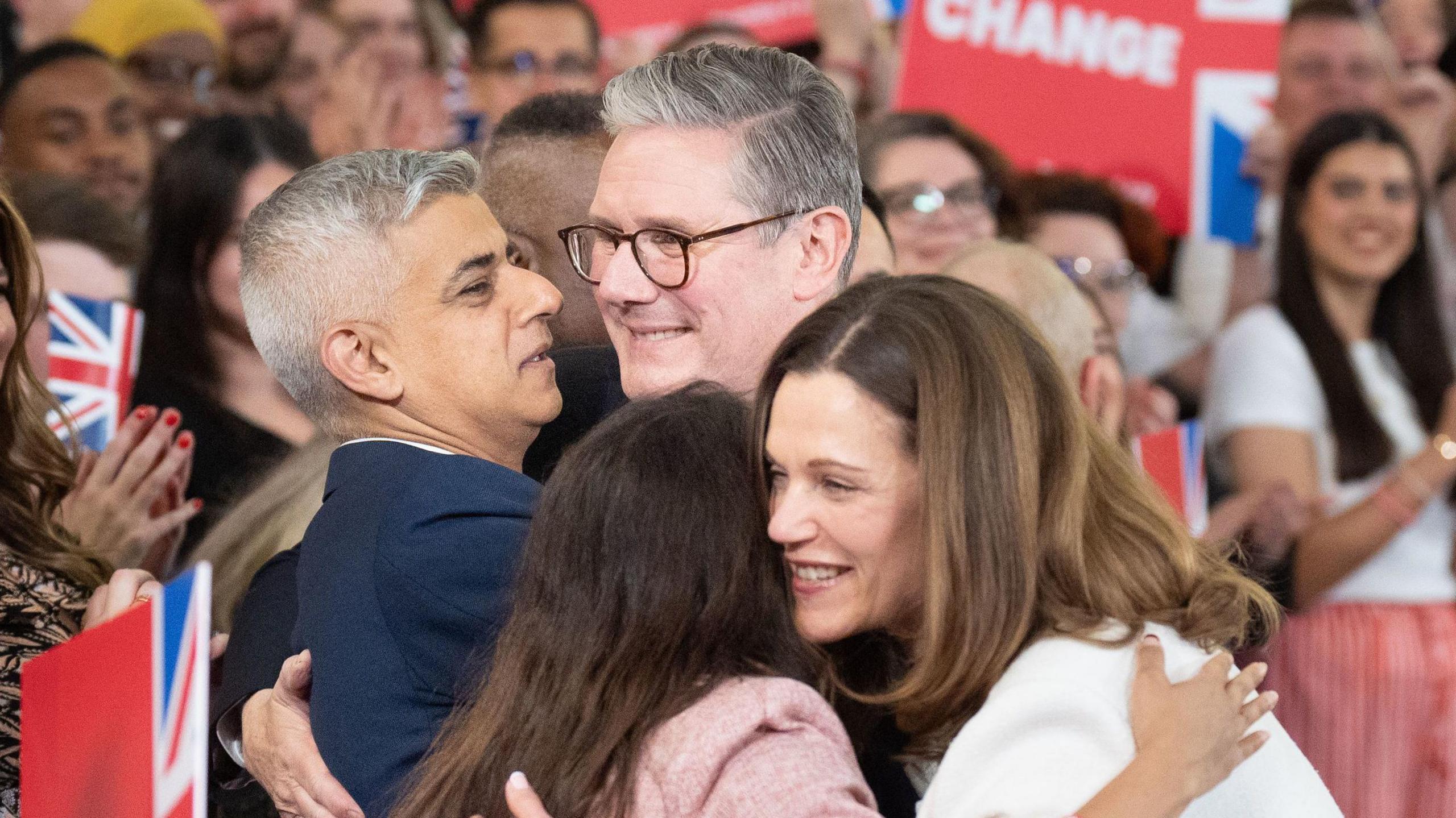 Sadiq Khan hugs Sir Keir Starmer while Sir Keir's wife Victoria hugs another woman