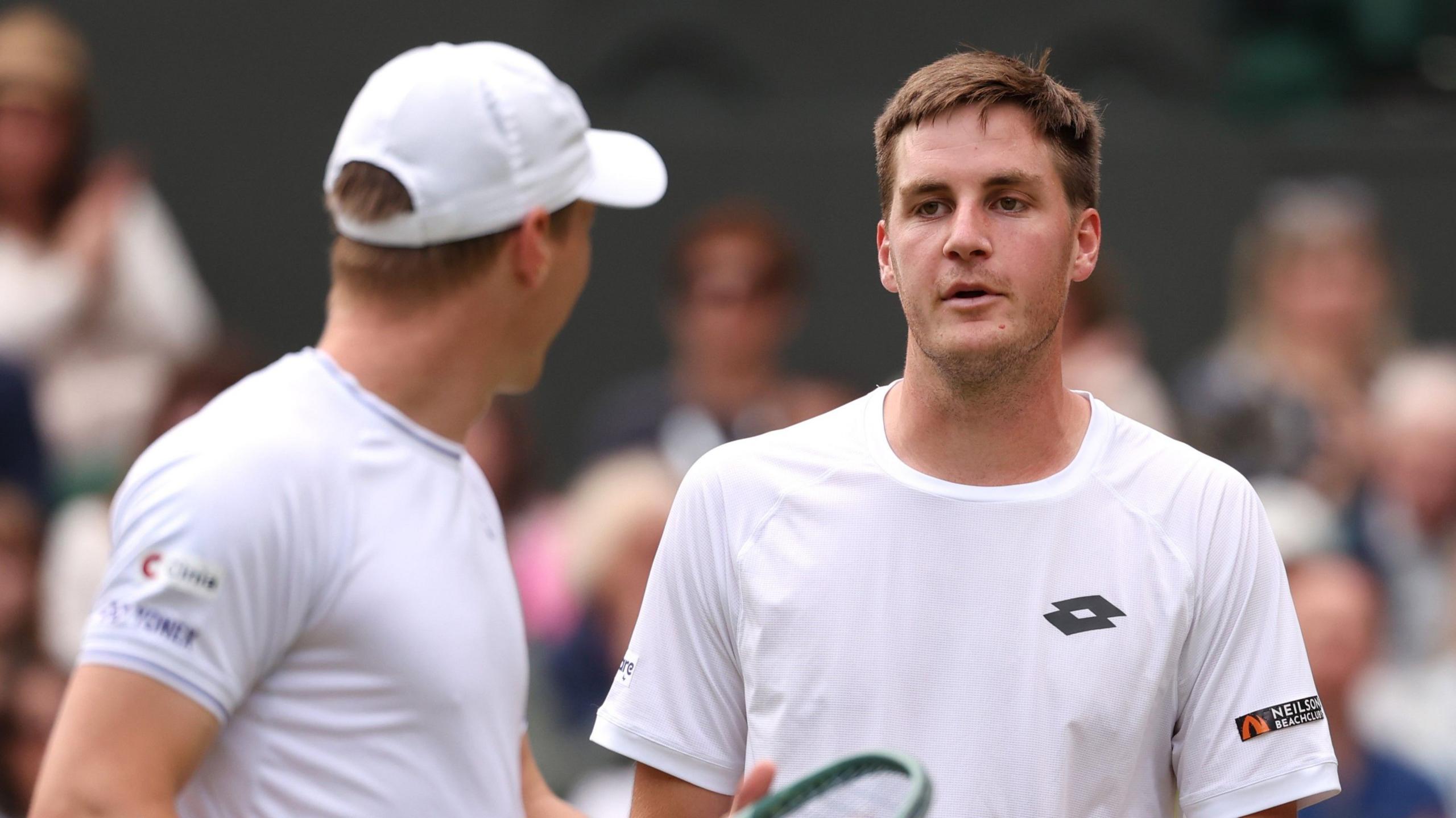 Henry Patten playing doubles with Harri Heliovaara at Wimbledon