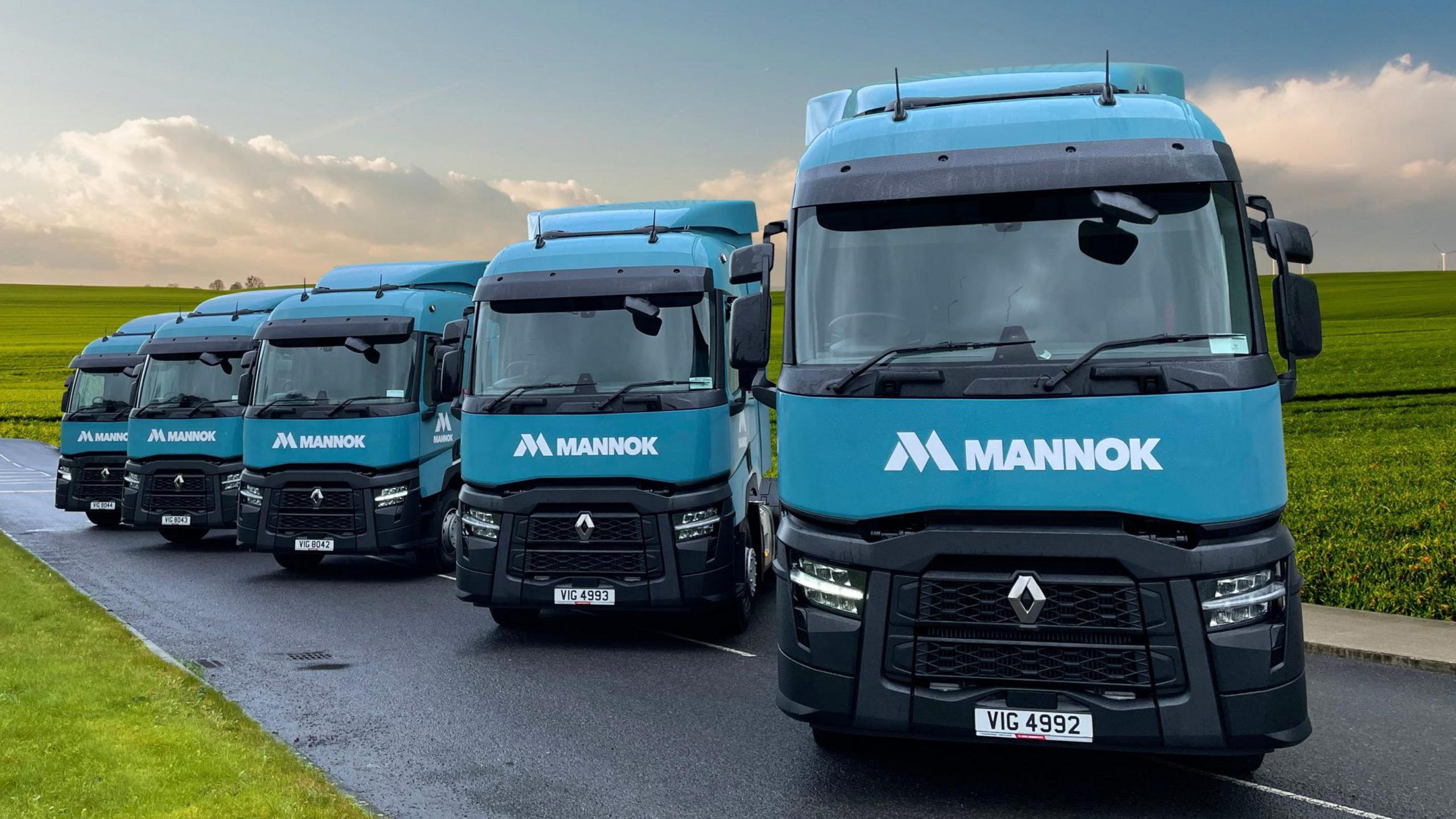 Five turquoise blue Mannok lorries 