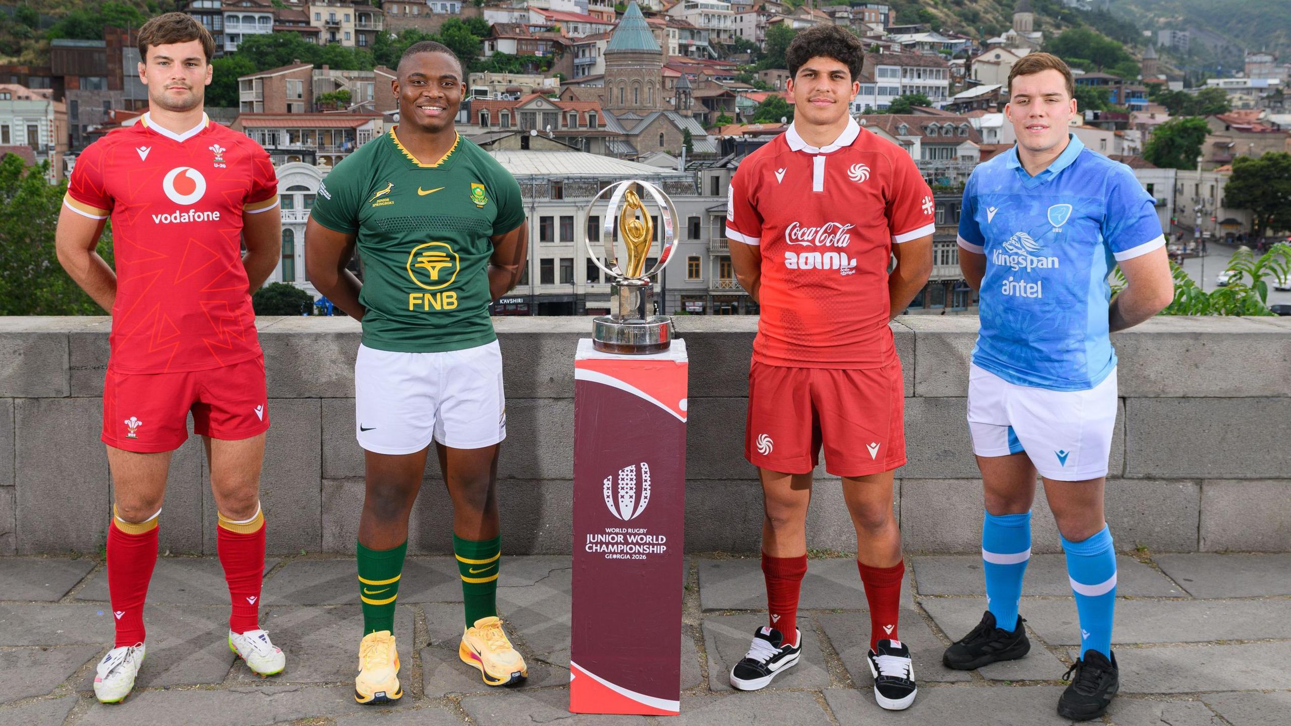 Wales captain Deian Gwynne in a line-up with Siphosethu Mnebelele of South Africa, Luka Narsia of Georgia and Ignacio Merli of Uruguay, with the Junior World Championship trophy in the middle