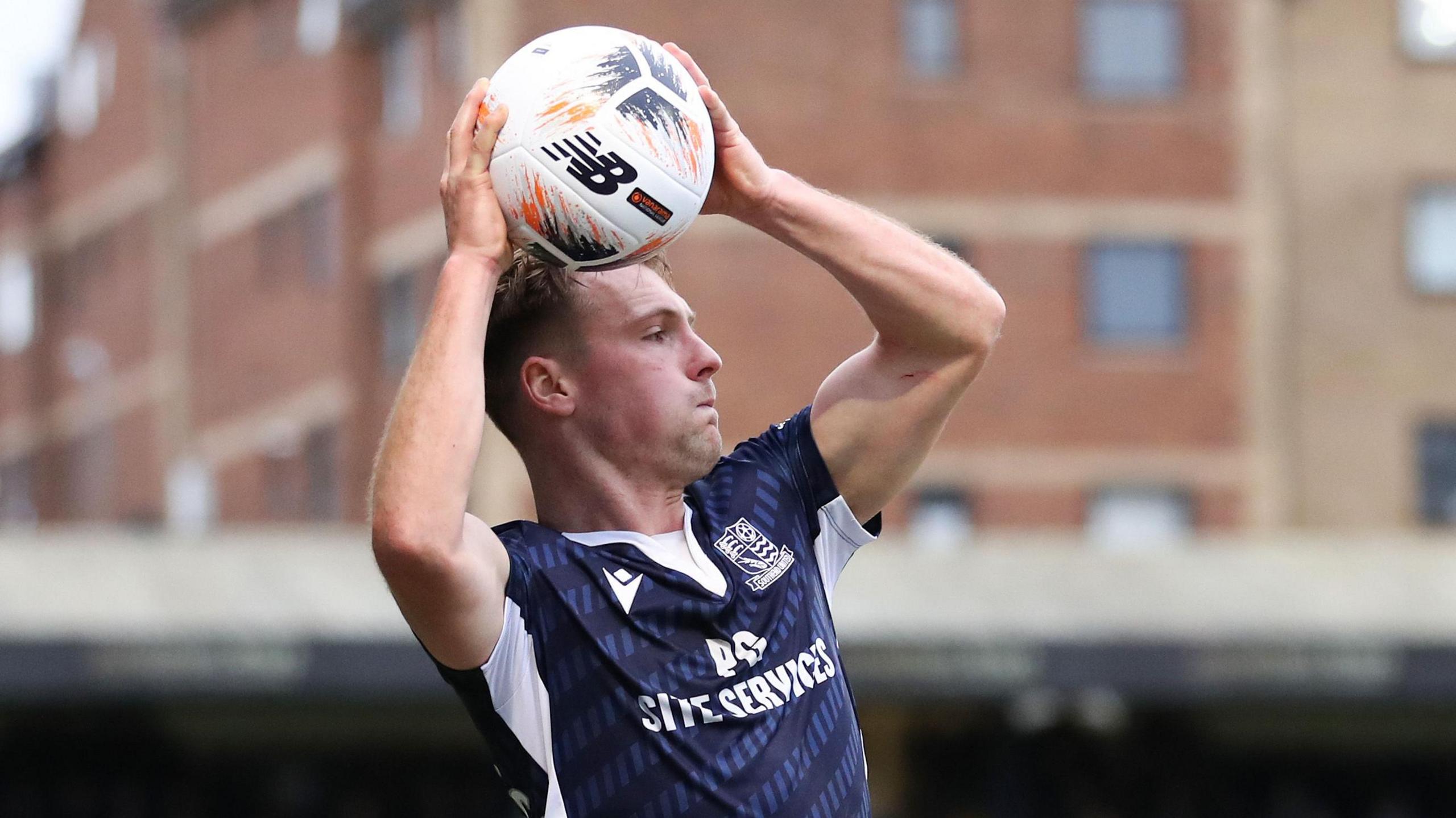 Gus Scott-Morriss takes a throw-in for Southend
