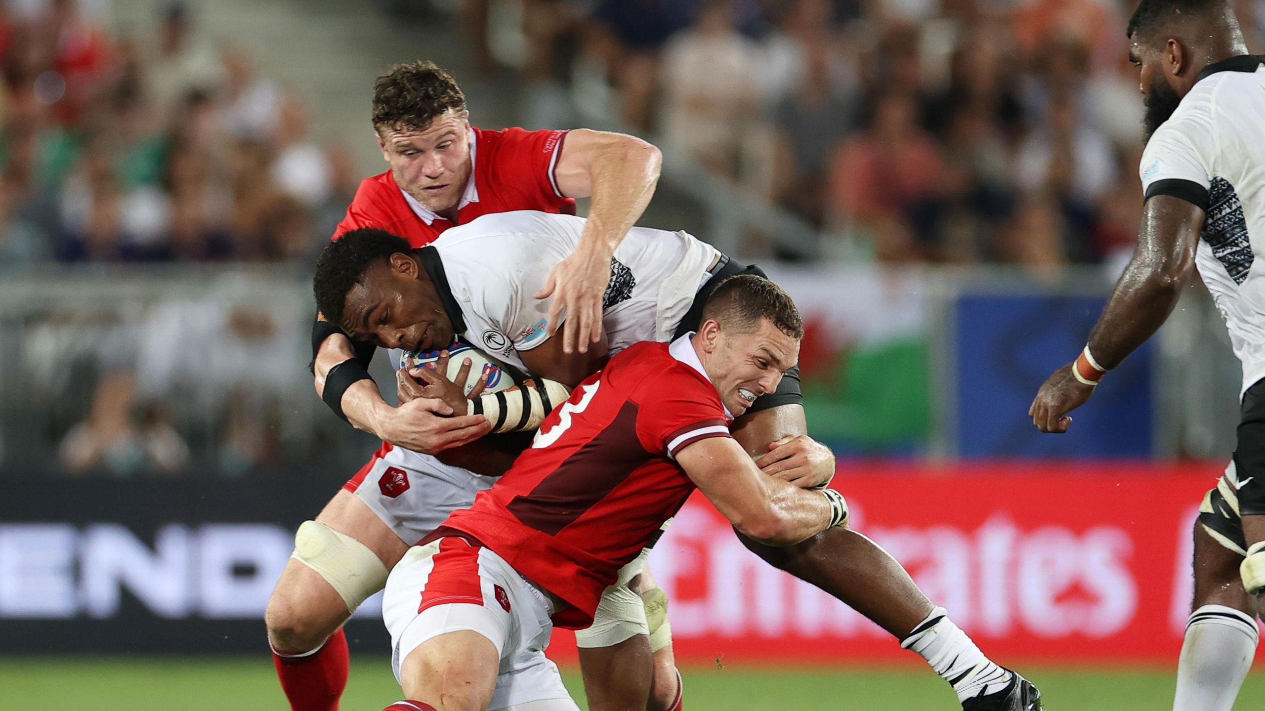 Waisea Nayacalevu of Fiji is tackled by George North of Wales