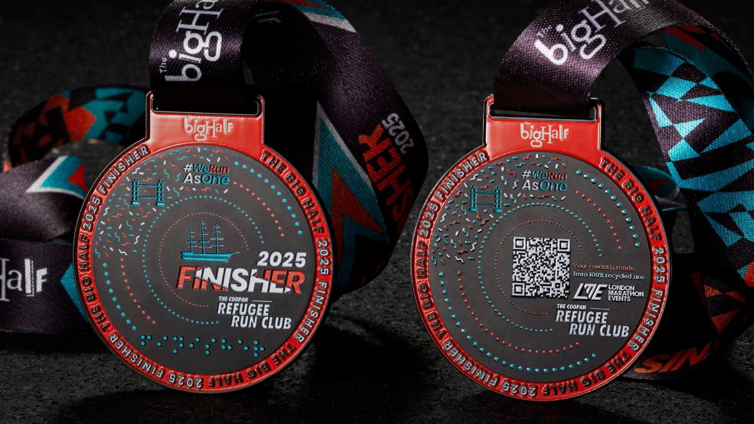 The Big Half finisher medal for 2025. It is red, black and teal. 