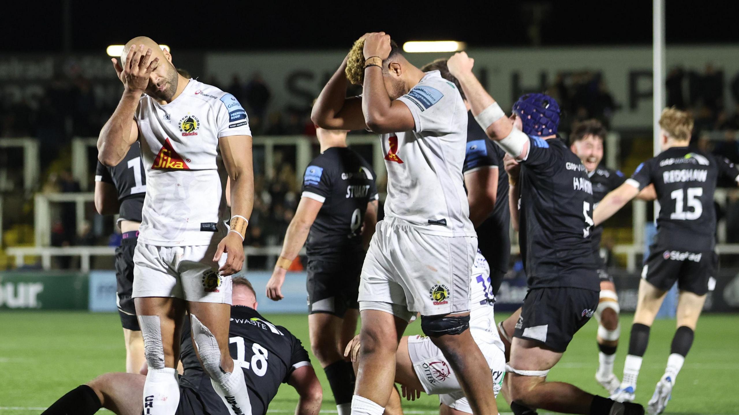 Exeter players look dejected after their loss at Newcastle 