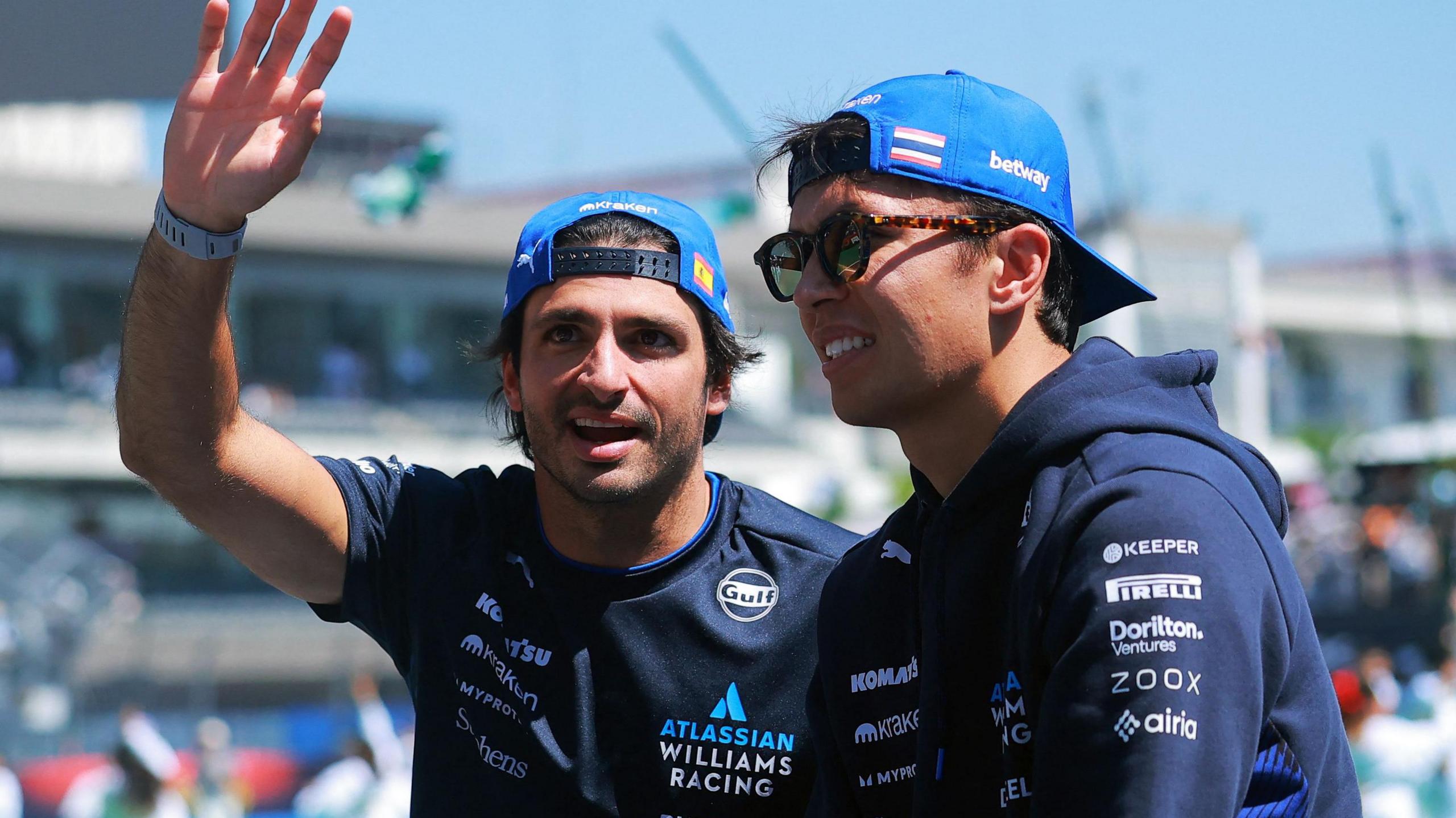 Carlos Sainz waves to the crowd while sat next to Williams team-mate Alex Albon during the drivers' parade at the Mexico City Grand Prix