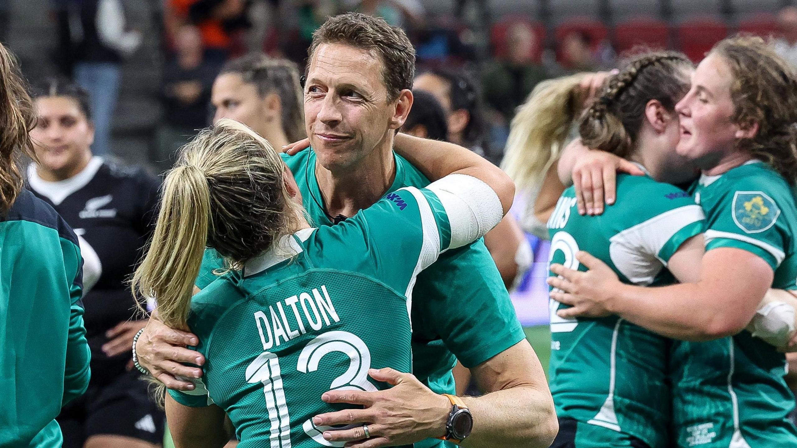 Ireland head coach Scott Bemand celebrates Ireland's thrilling win over New Zealand with centre Aoife Dalton