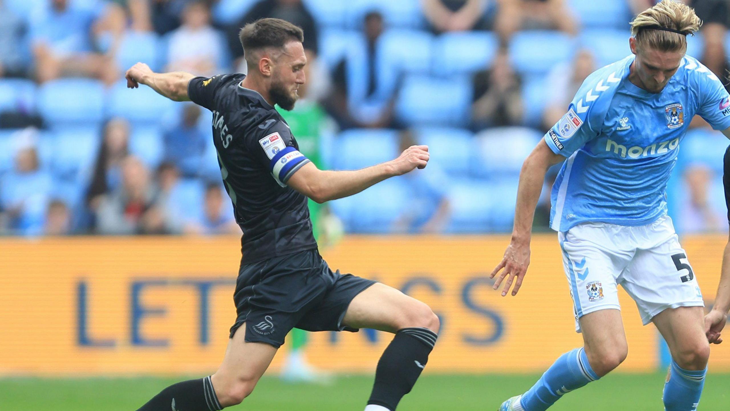 Matt Grimes tackles Coventry's Jack Rudoni in Swansea's 2-1 win in September at the CBS Arena