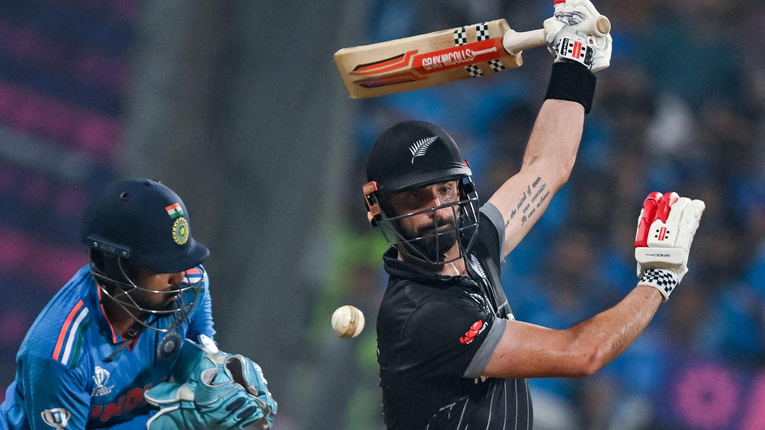 India wicketkeeper KL Rahul and New Zealand batter Daryl Mitchell during an ODI at the 2023 World Cup