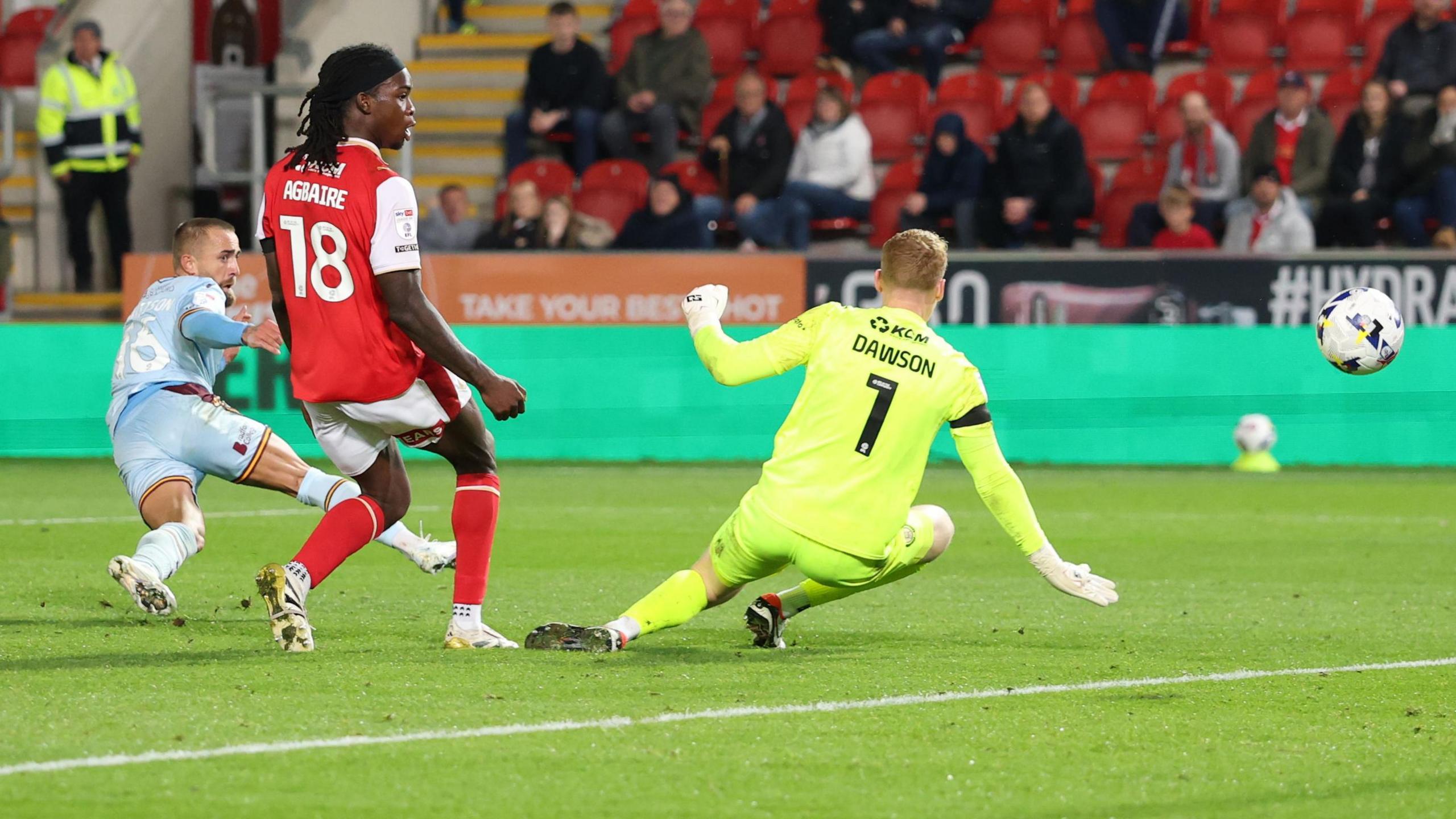 Alex Pattison finishes past Cam Dawson in the Rotherham goal