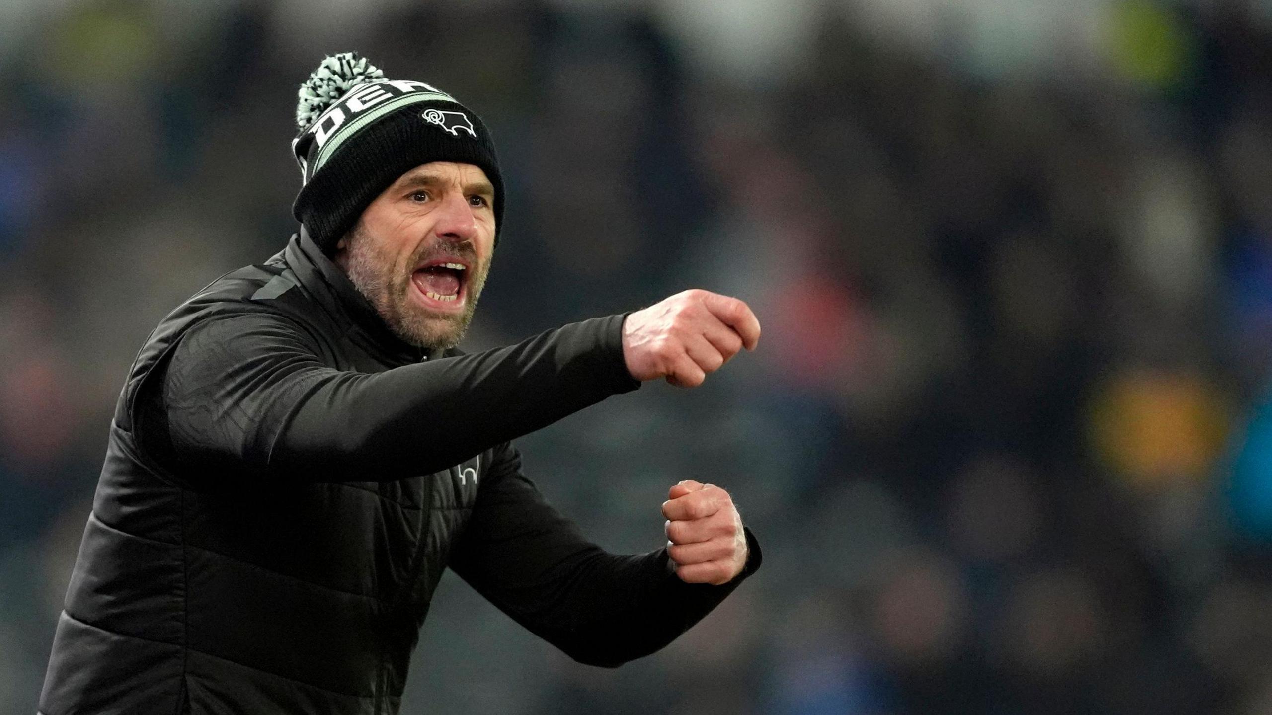 Derby County boss Paul Warne points and shouts instructions to his players