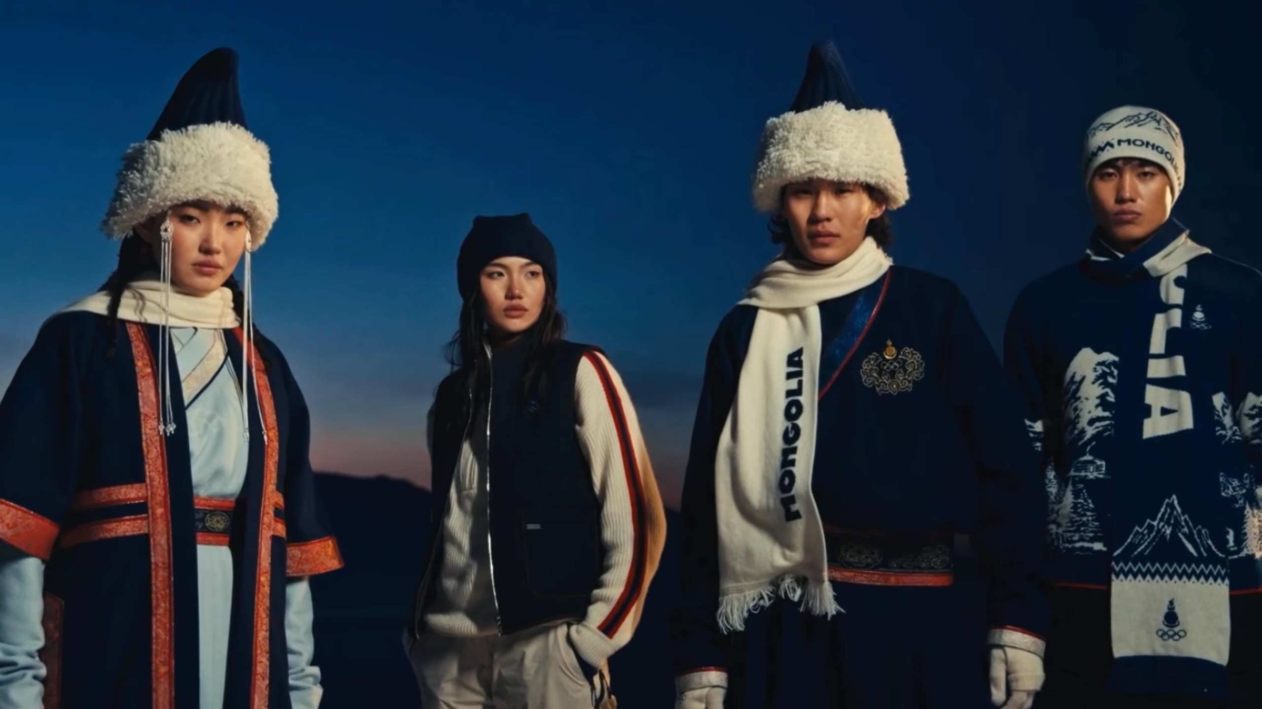 Four people in traditional gowns.