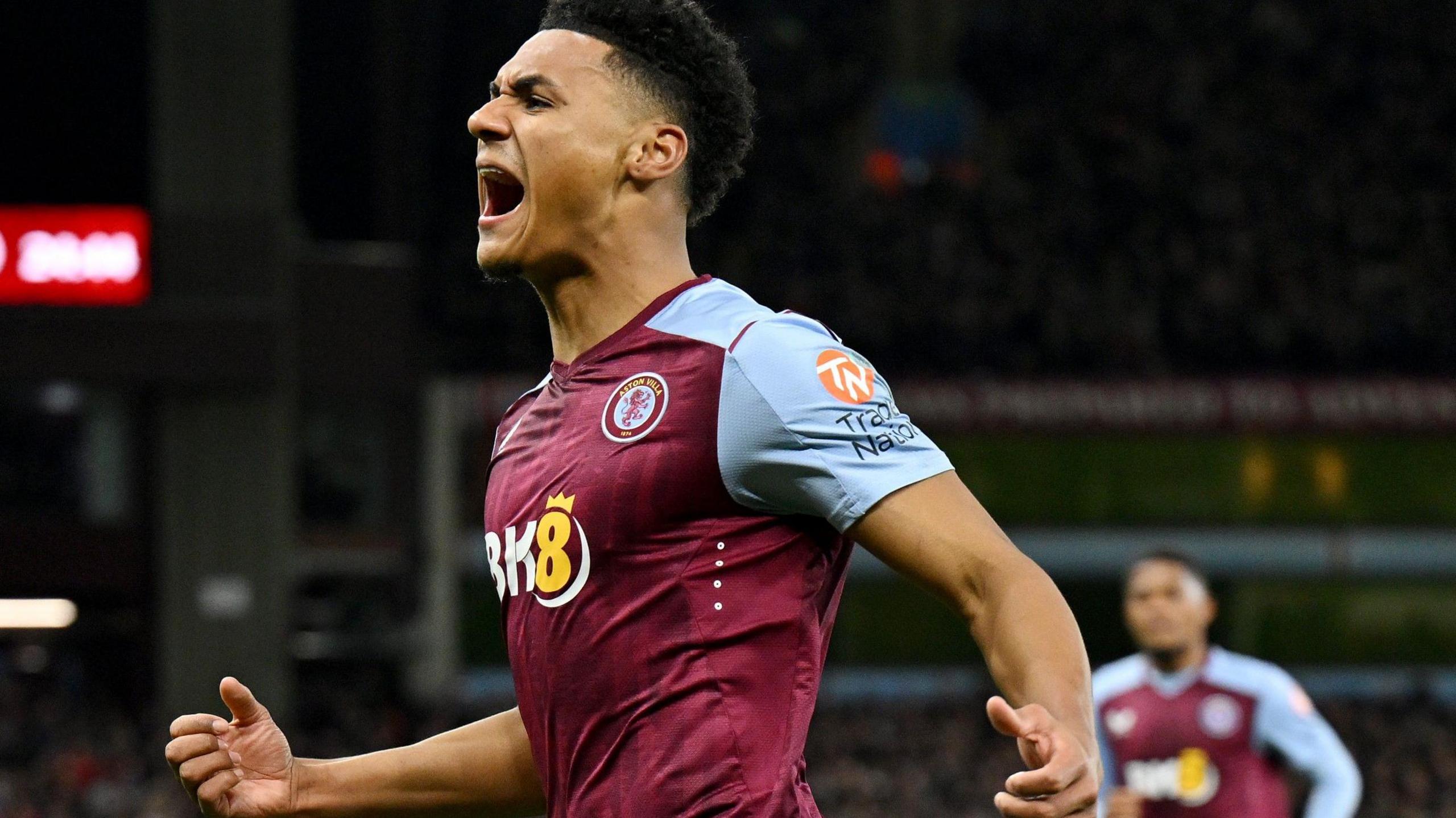 Ollie Watkins celebrates a goal as he screams after scoring.