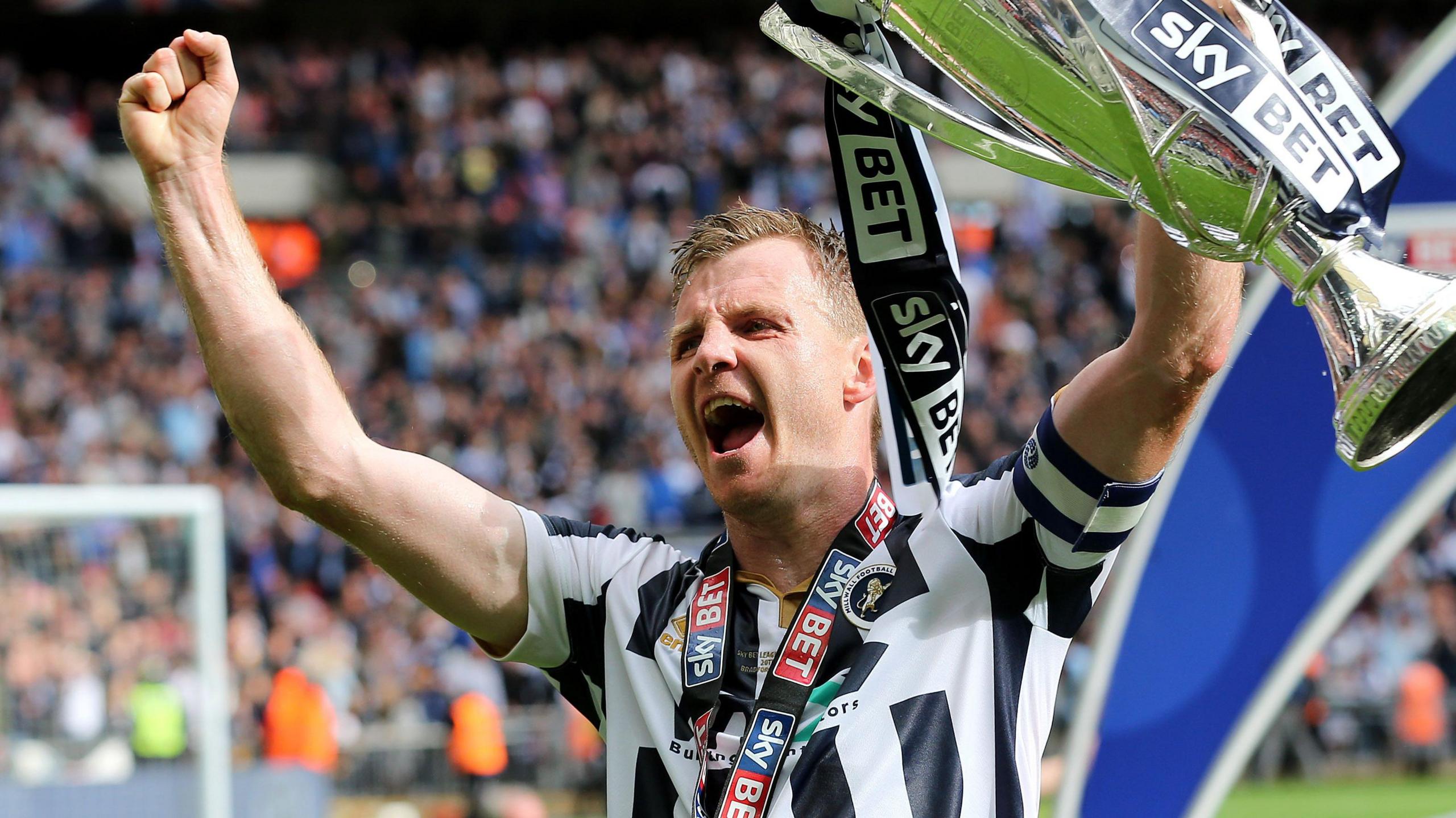 Tony Craig lifts the trophy after captaining Millwall to victory in the 2017 League One play-offs