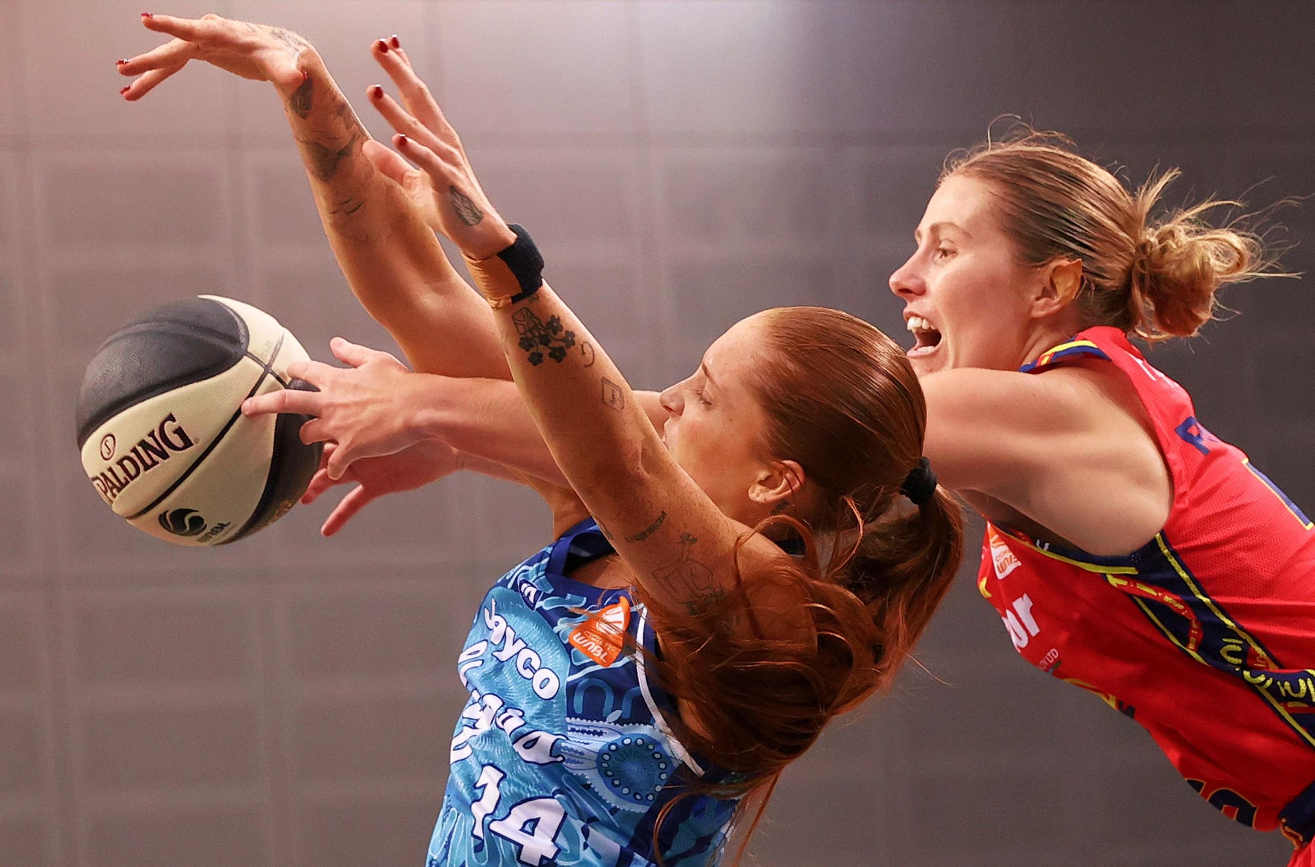 Georgia Pineau of the Lightning blocks Tayah Burrows of the Flyers during the round six WNBL match between Southside Flyers and Adelaide Lightning at State Basketball Centre, Melbourne