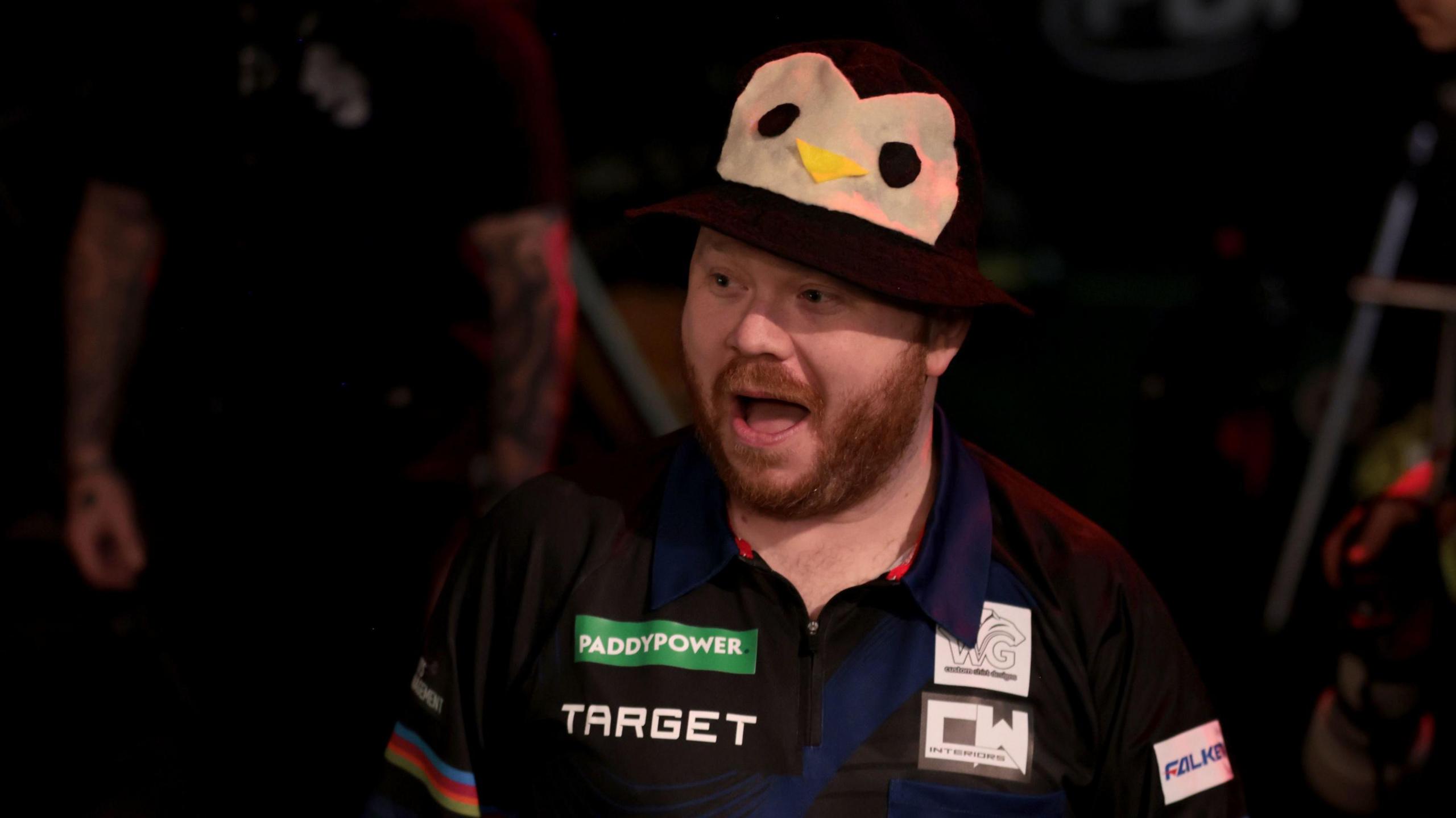 Justin Hood wears a penguin bucket hat