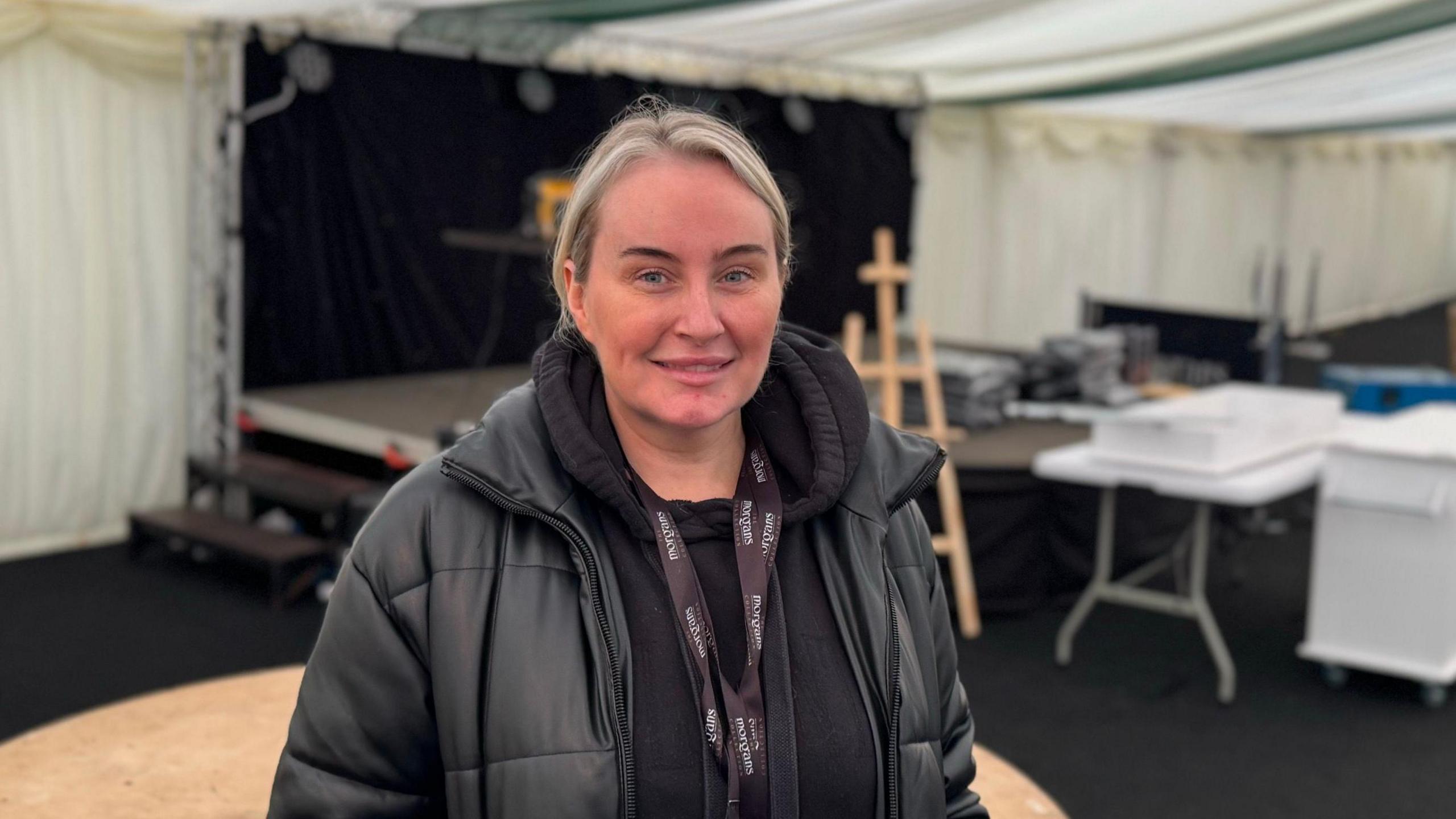 Girl smiling in marquee 