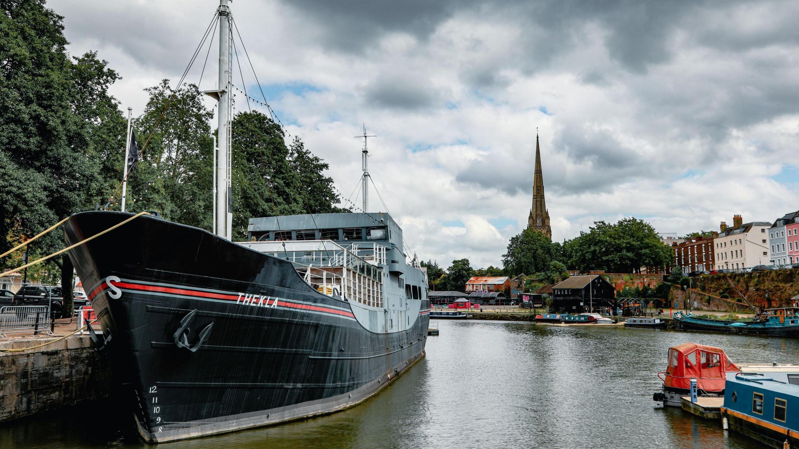 An external shot of Thekla on the water